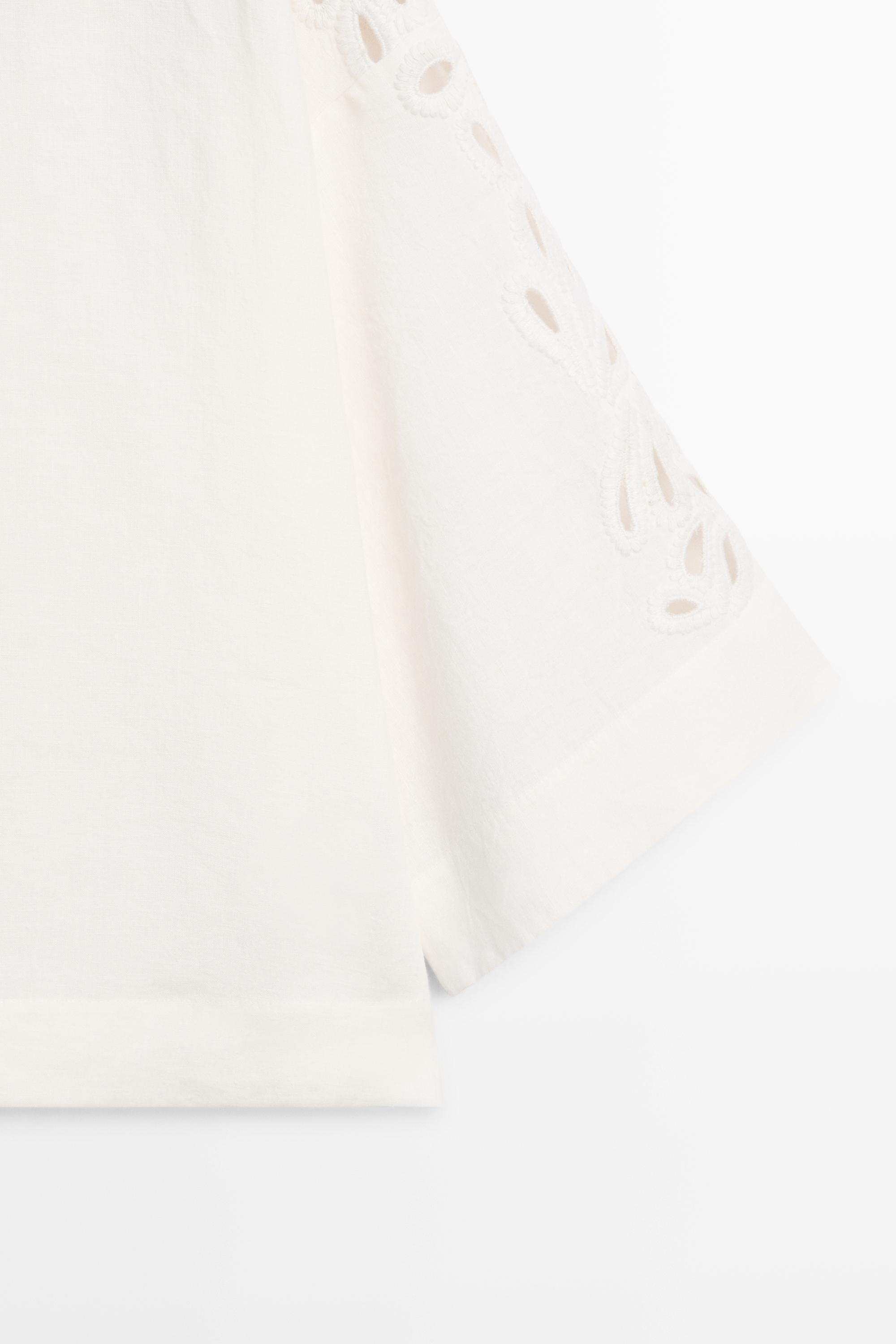 Linen boat neck blouse with embroidery