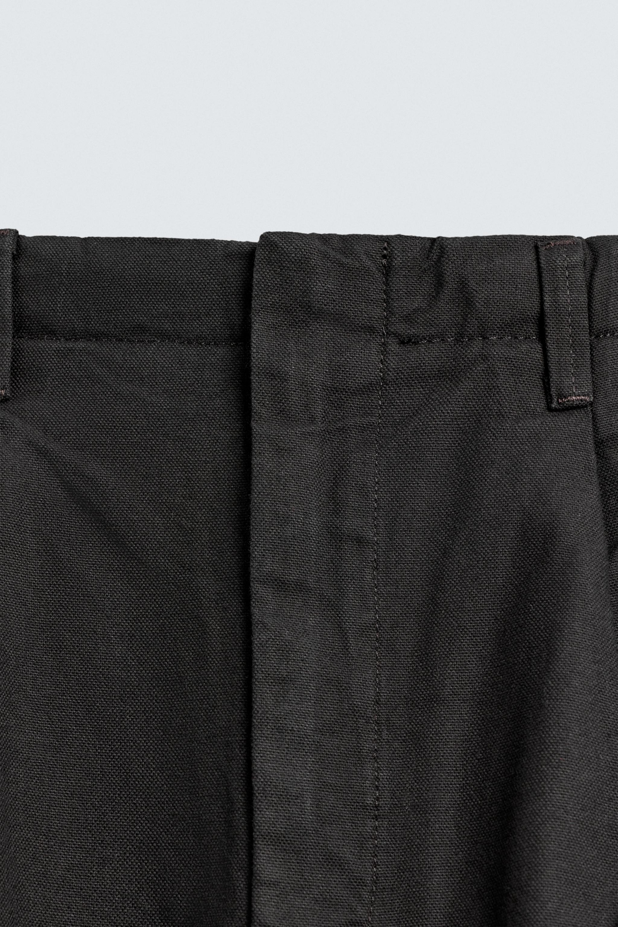 WIDE FIT PLEATED PANTS