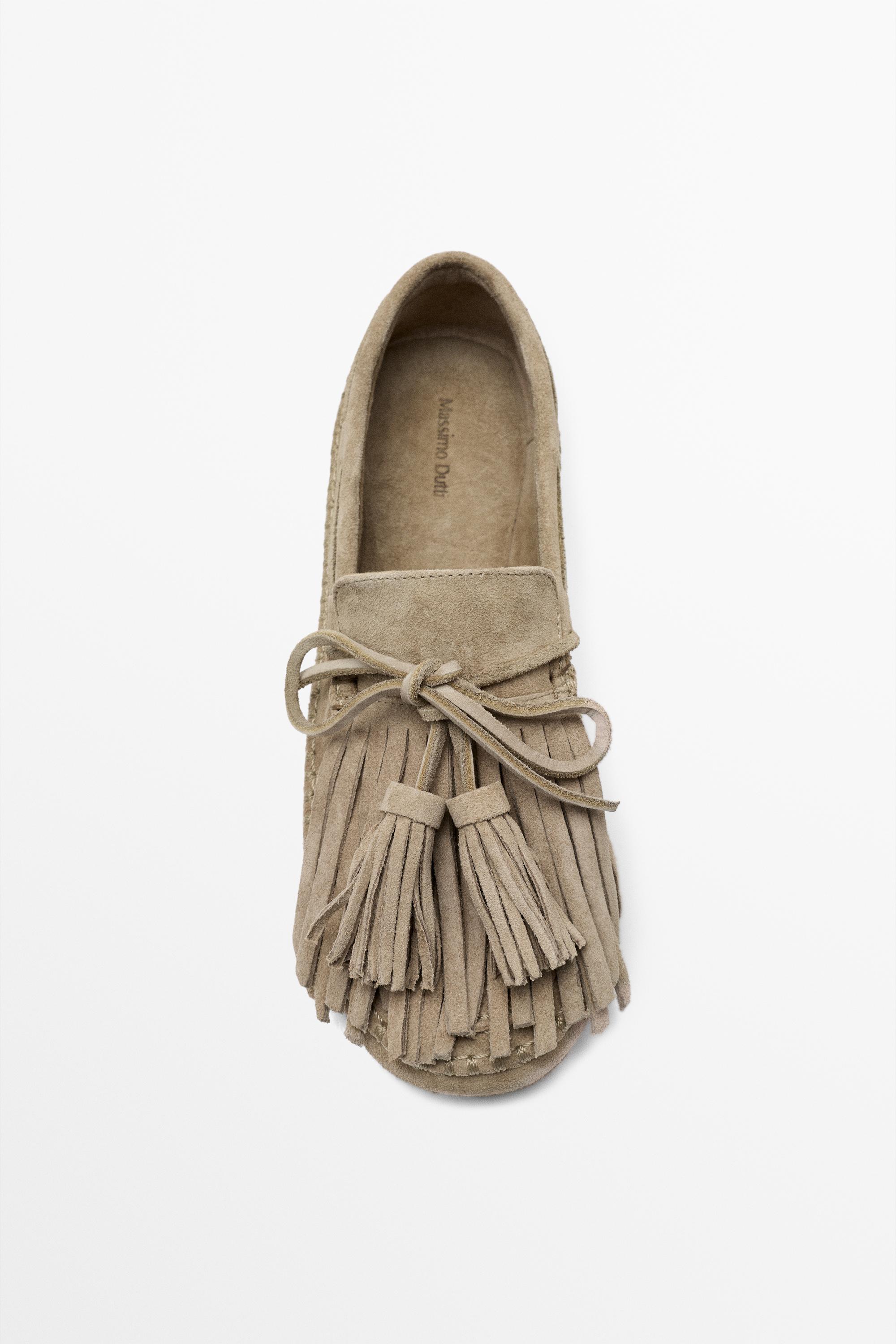 Leather loafers with fringing and tassels