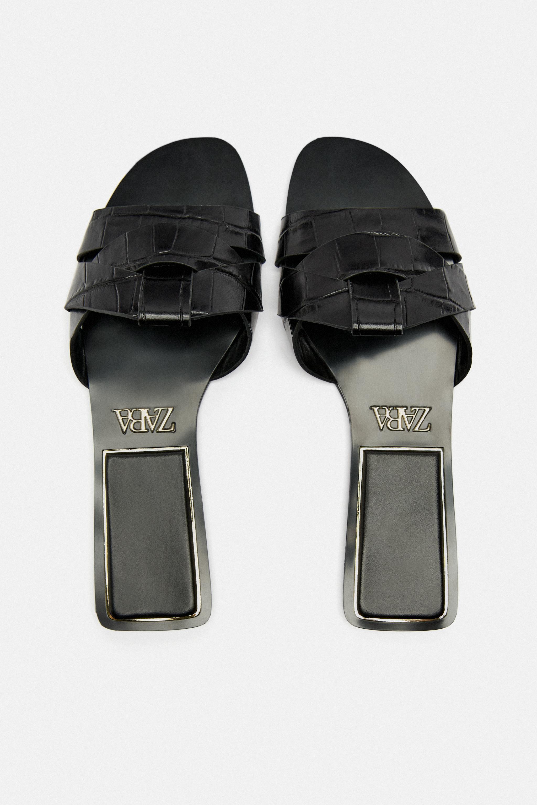 FLAT CROSSED LEATHER SANDALS