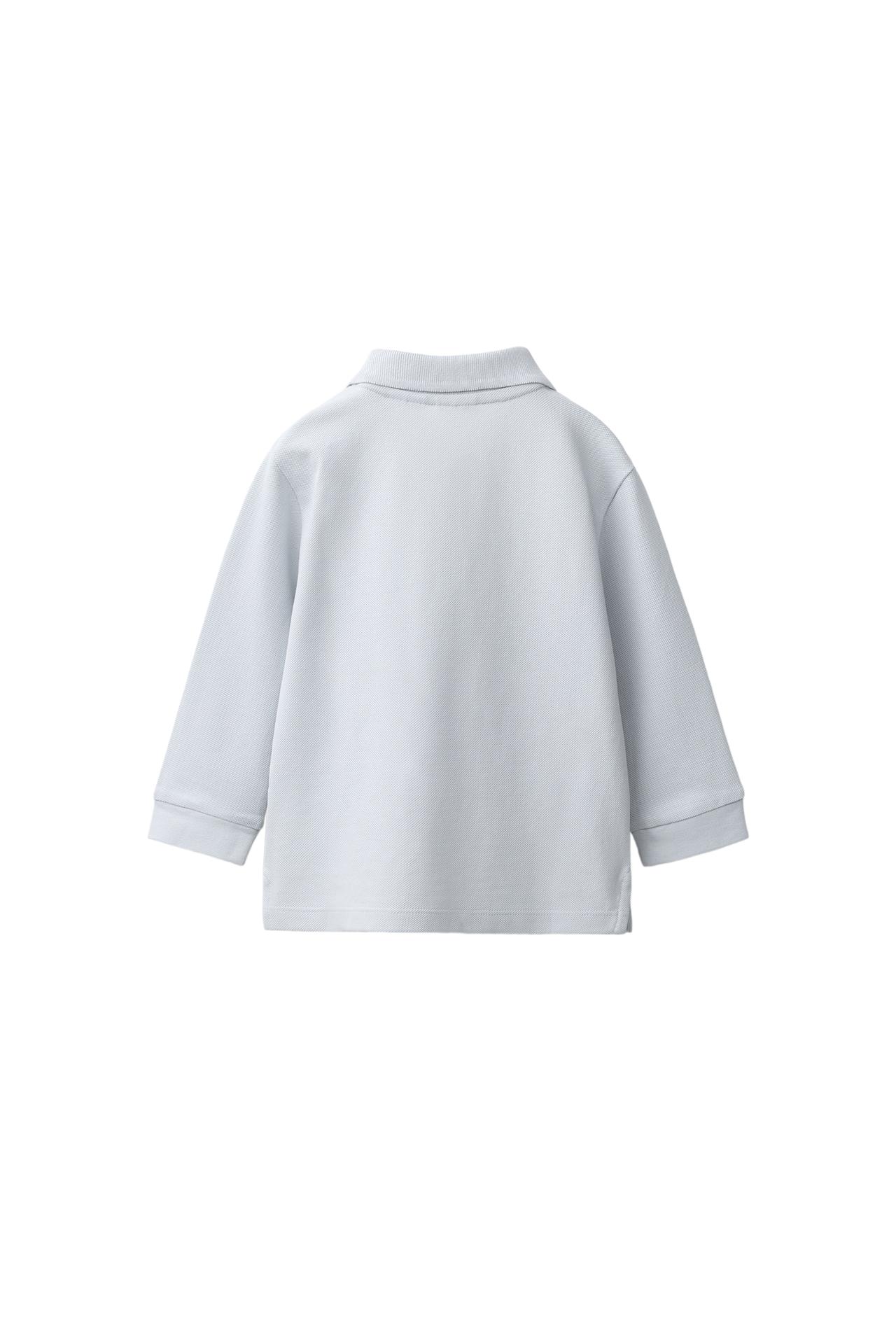 SOLID PIQUÉ POLO SHIRT — Light blue
