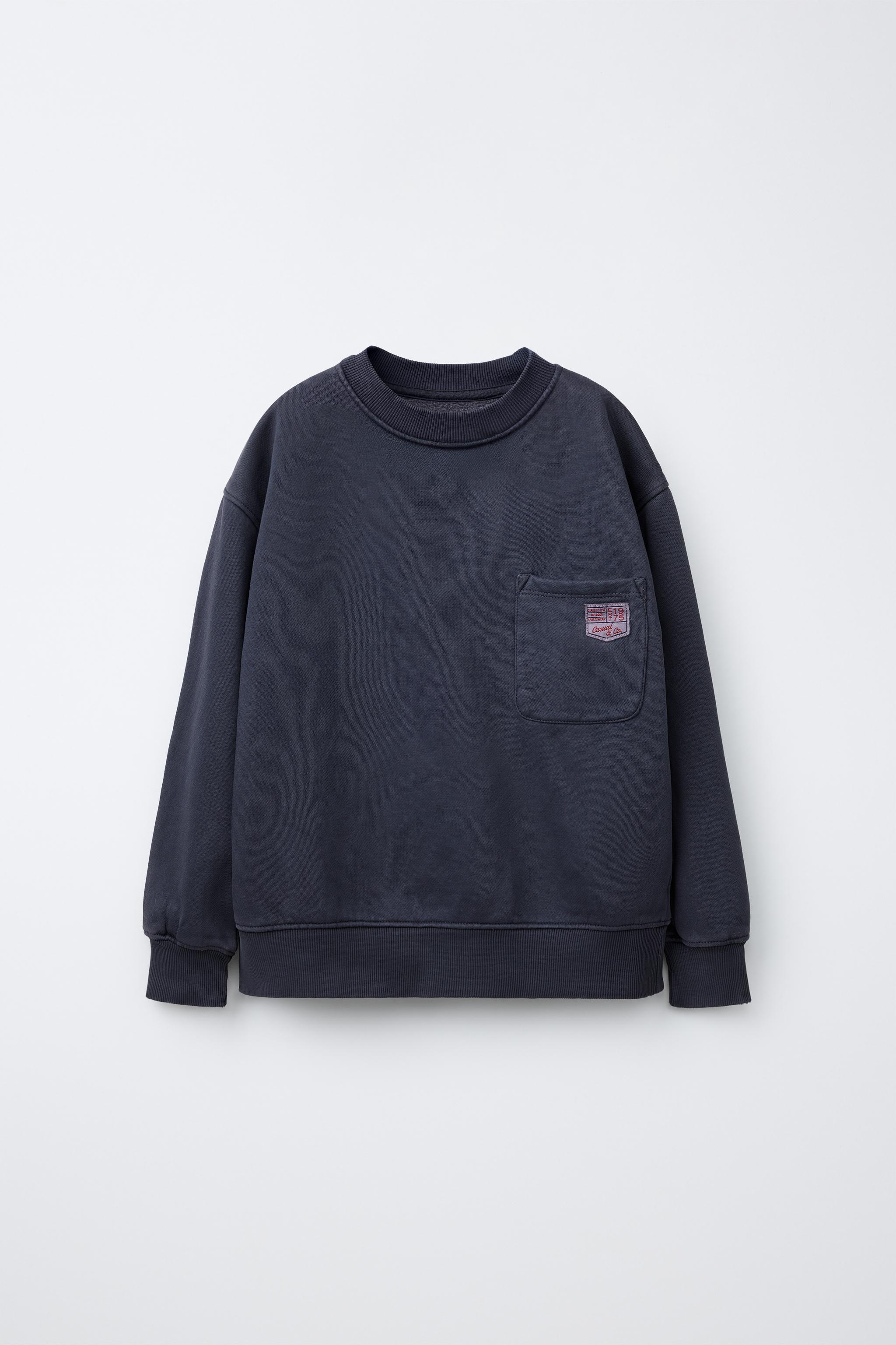SUDADERA LISA BOLSILLO ETIQUETA