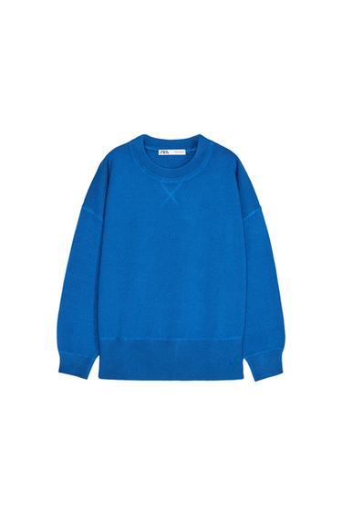 Front view of a blue sweatshirt with a crew neck and long sleeves.
