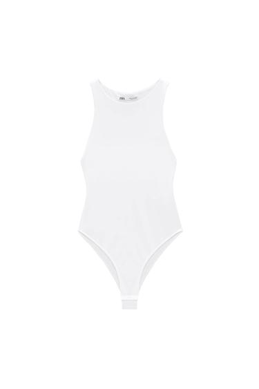 Sleeveless white bodysuit on a white background, visible label with the text "Zara".