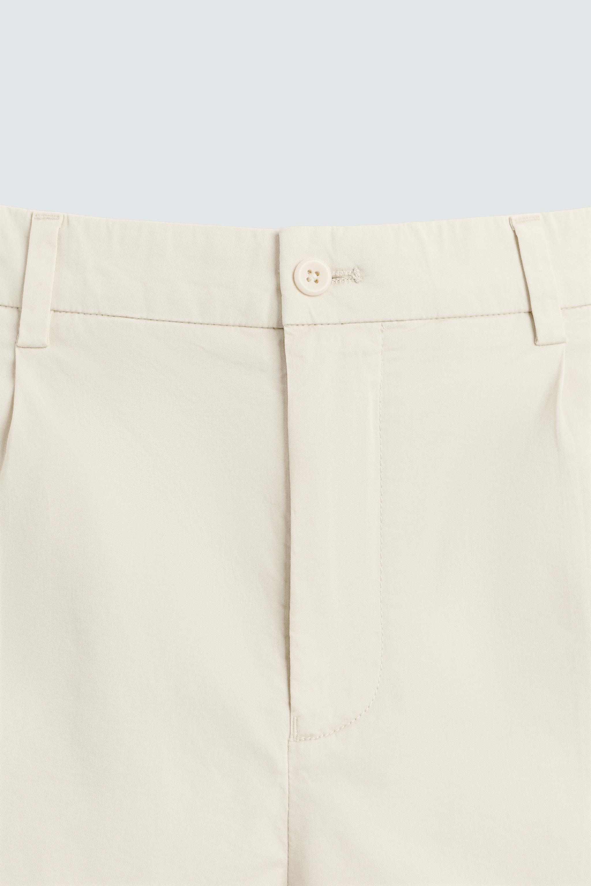 REGULAR FIT PLEATED BERMUDA SHORTS