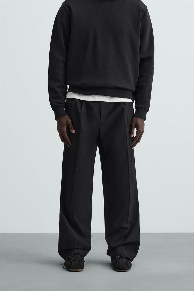 WIDE FIT PLEATED TROUSERS