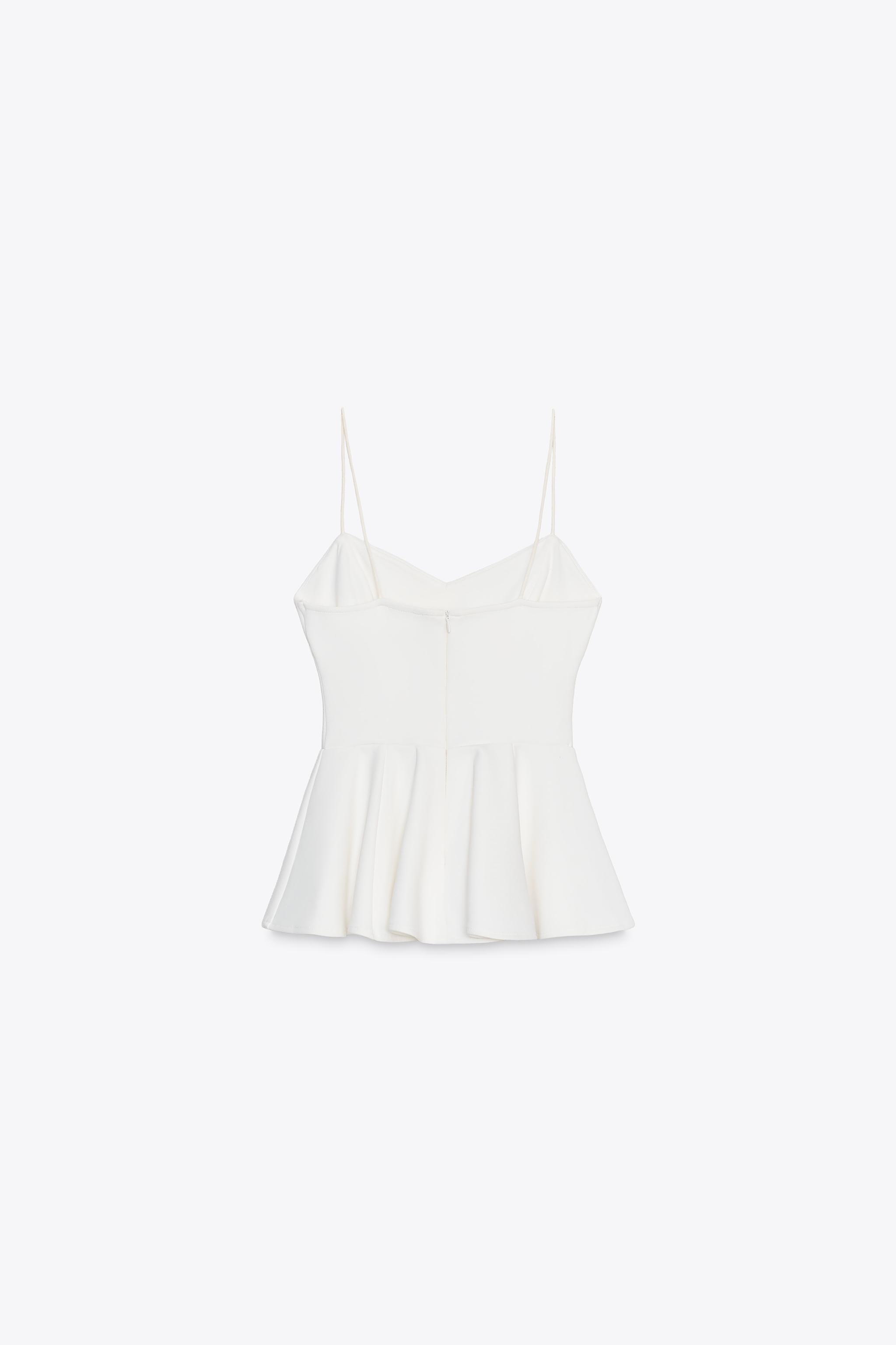INTERLOCK PEPLUM STRAPPY TOP