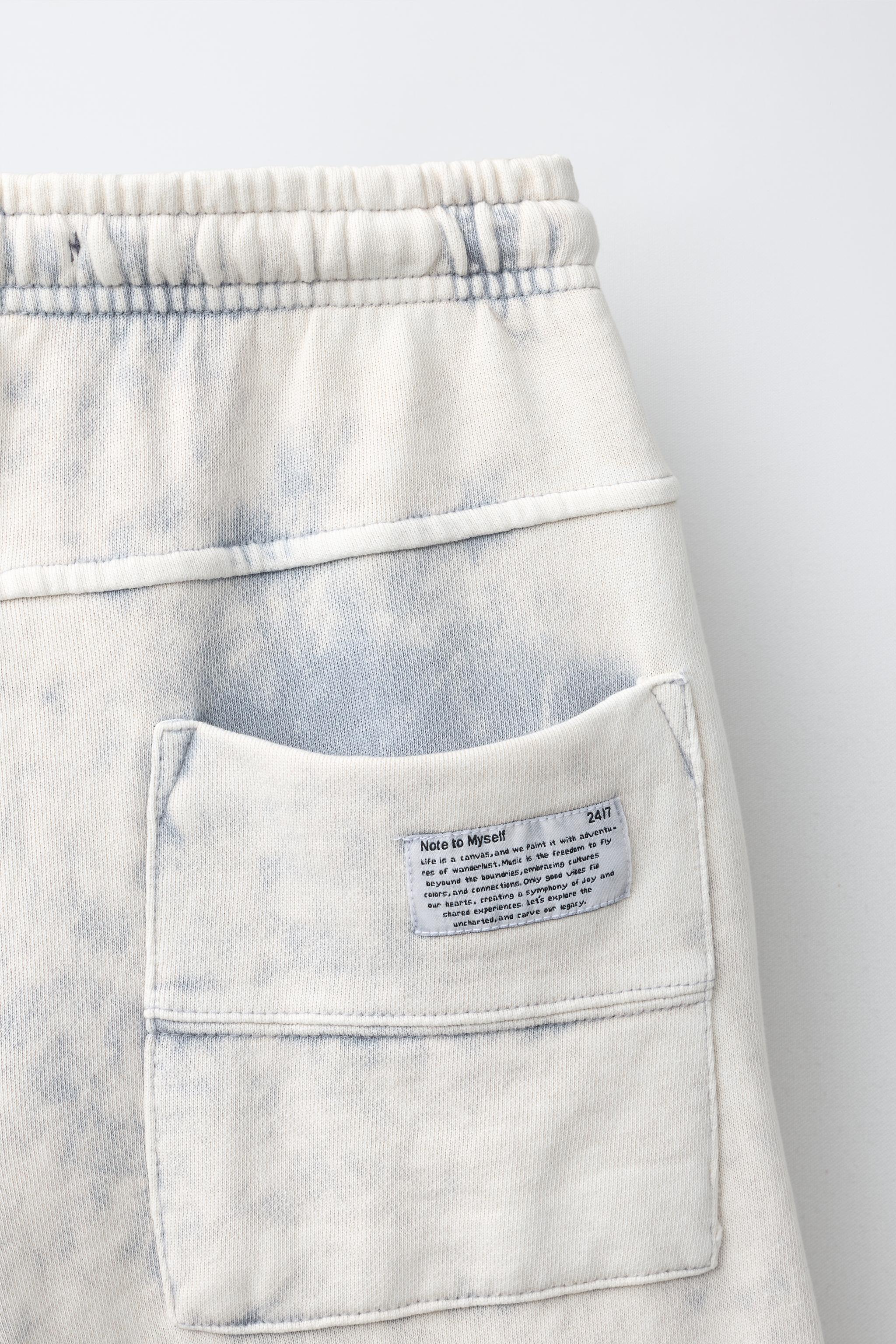 WASHED EFFECT STAR PATCH LONG BERMUDA SHORTS