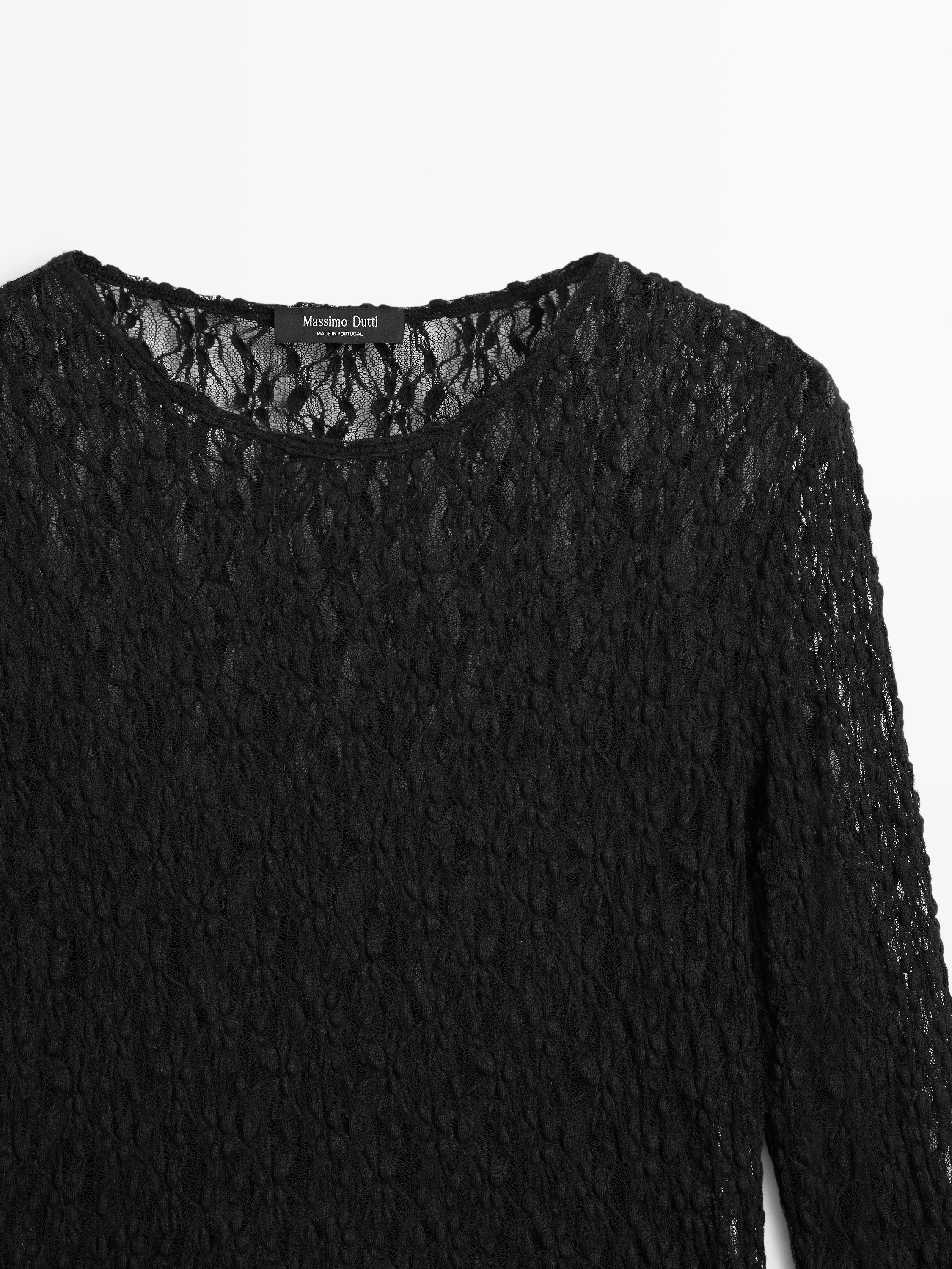Openwork knit top with long sleeves and lace