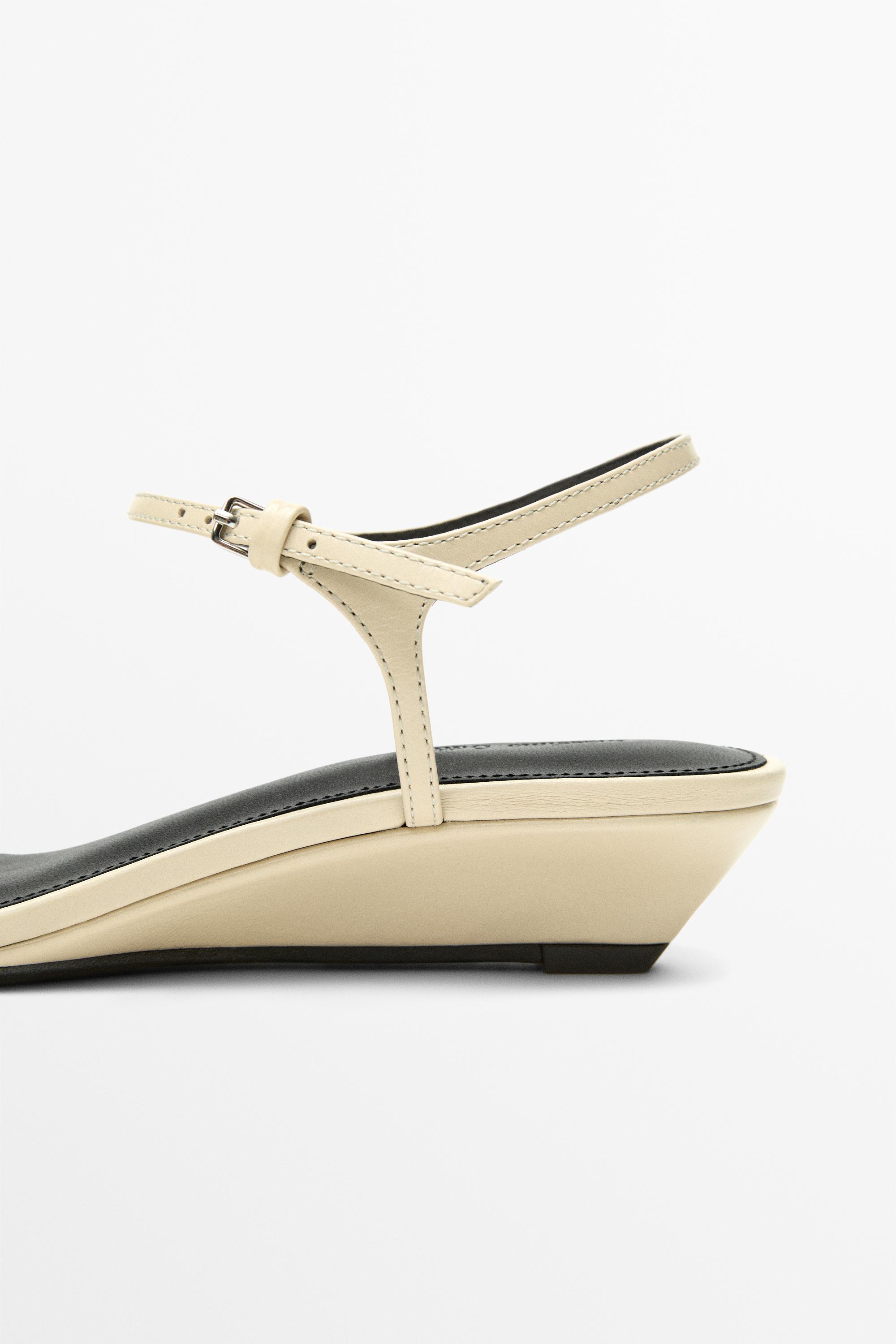 Sandale en cuir à brides compensées