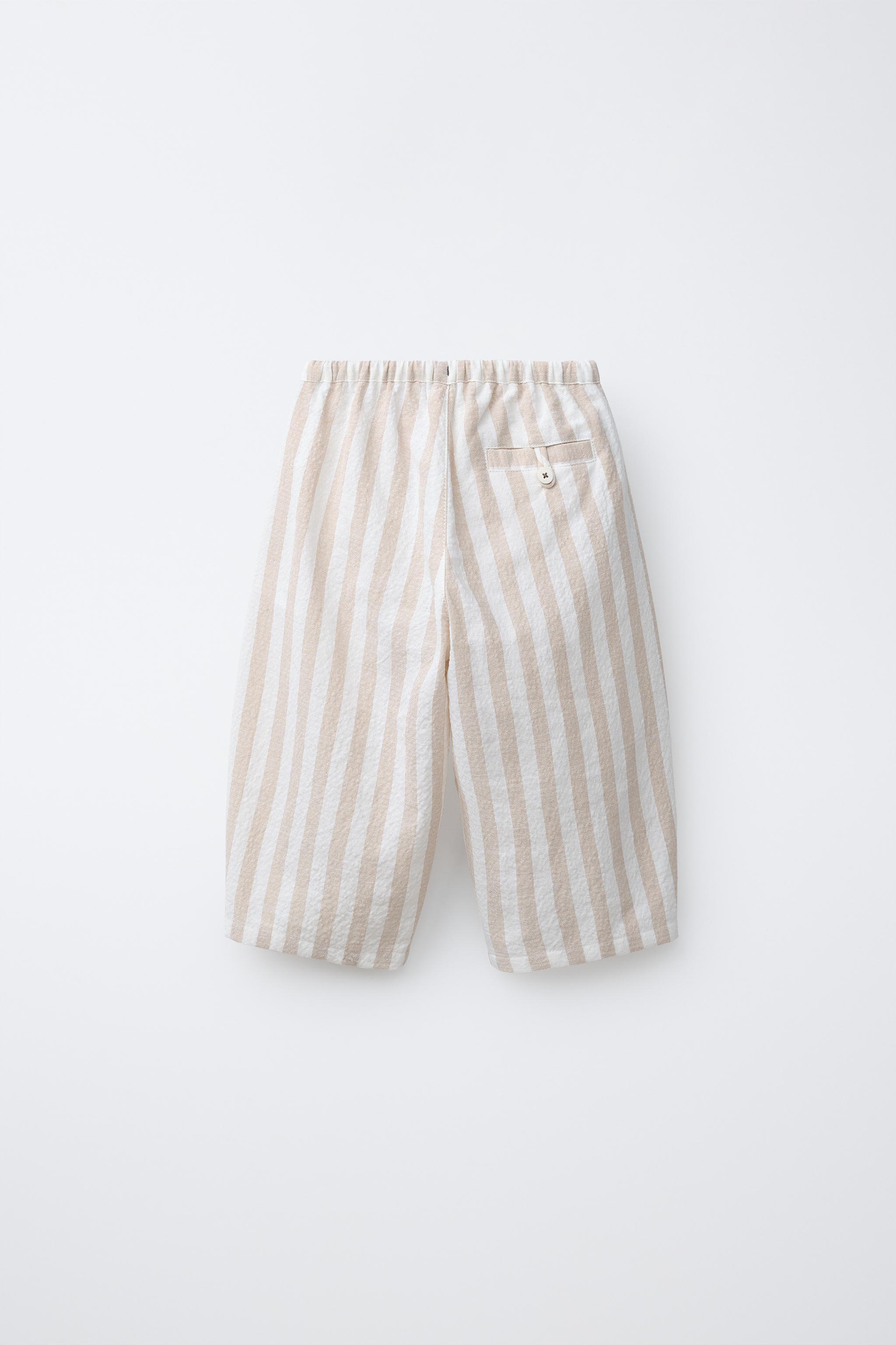 STRIPED PLEATED BALLOON PANTS