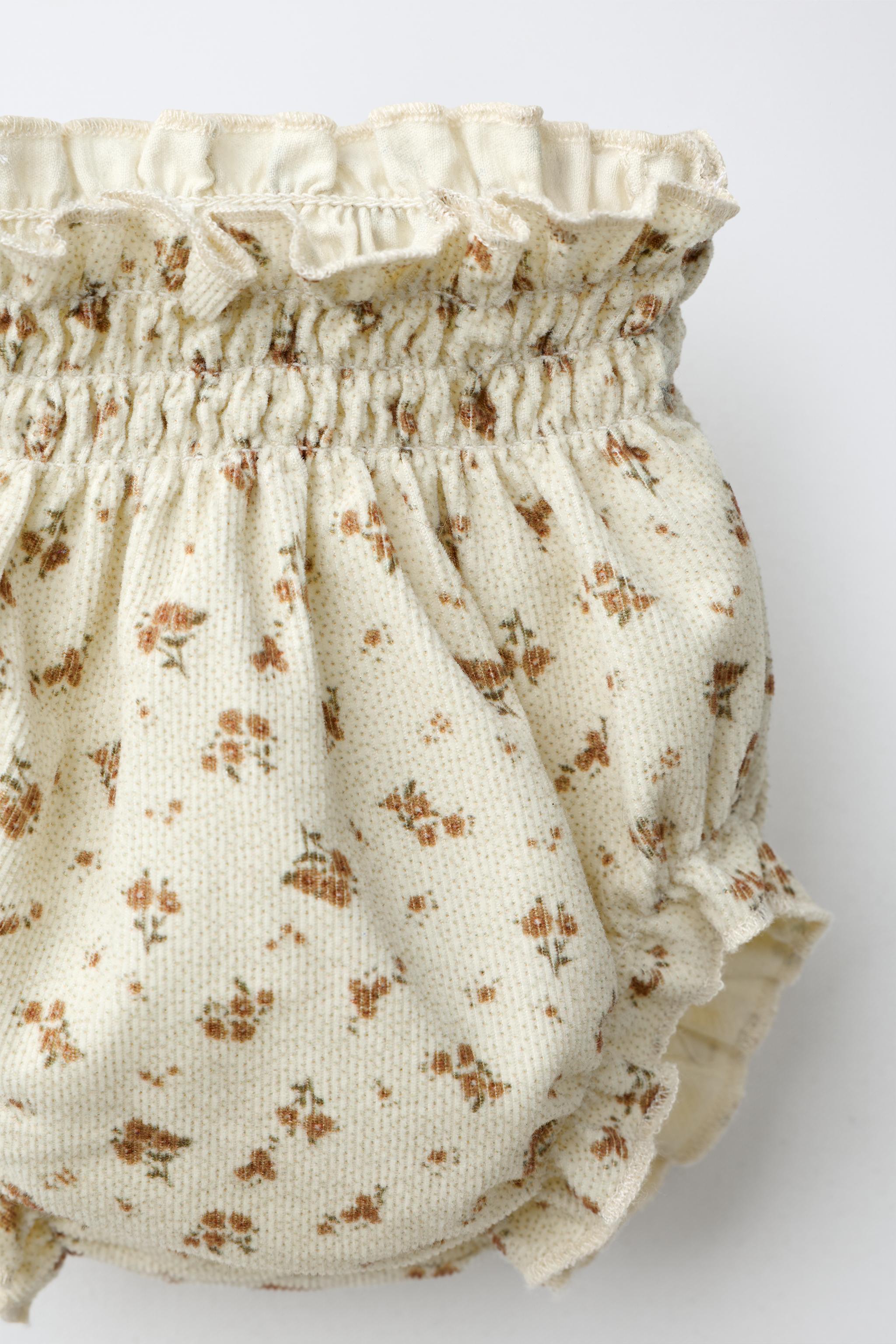 CULOTTE EN VELOURS CÔTELÉ FIN À FLEURS