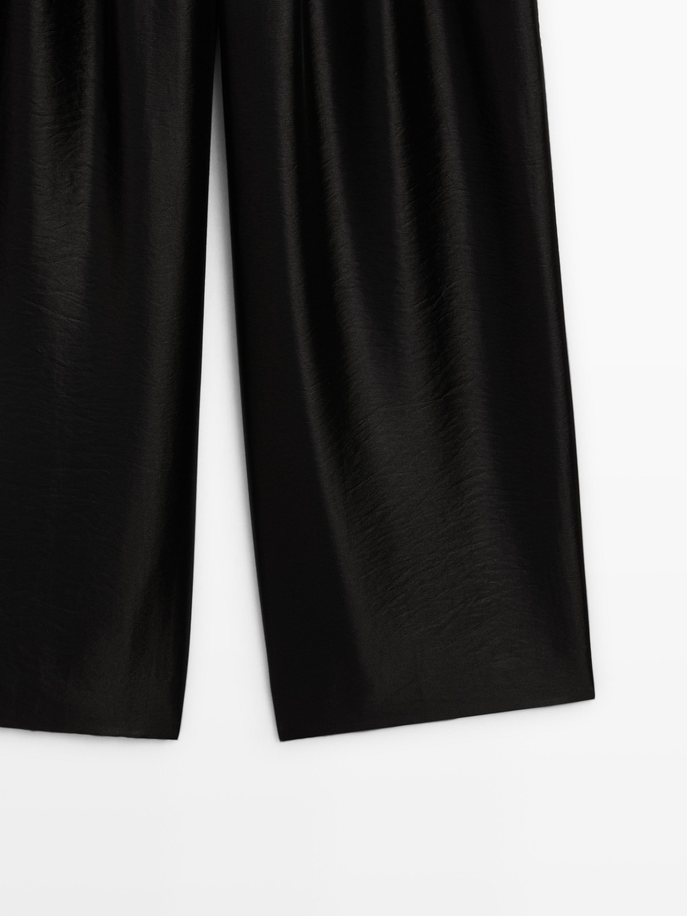 Wide-leg voluminous trousers with darts