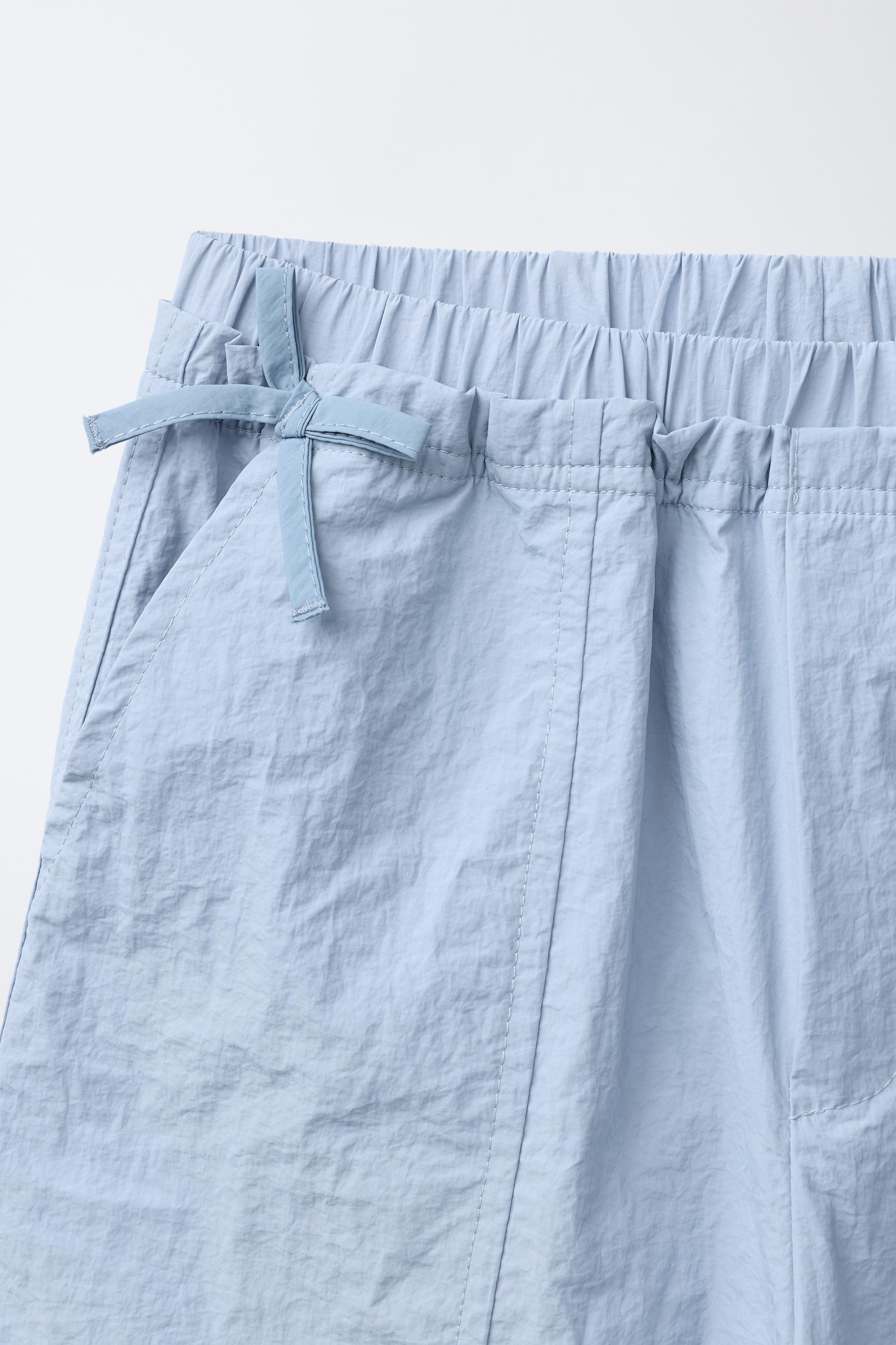 NYLON PANTS WITH BOWS
