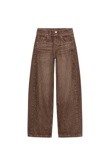Front view of rust-coloured, mid-rise, wide-leg jeans with five pockets and a zip fly and button fastening.