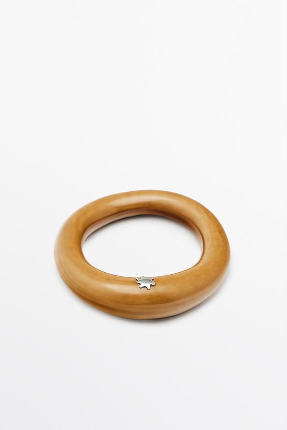 Ceramic tubular bracelet with star detail from Zara - $130