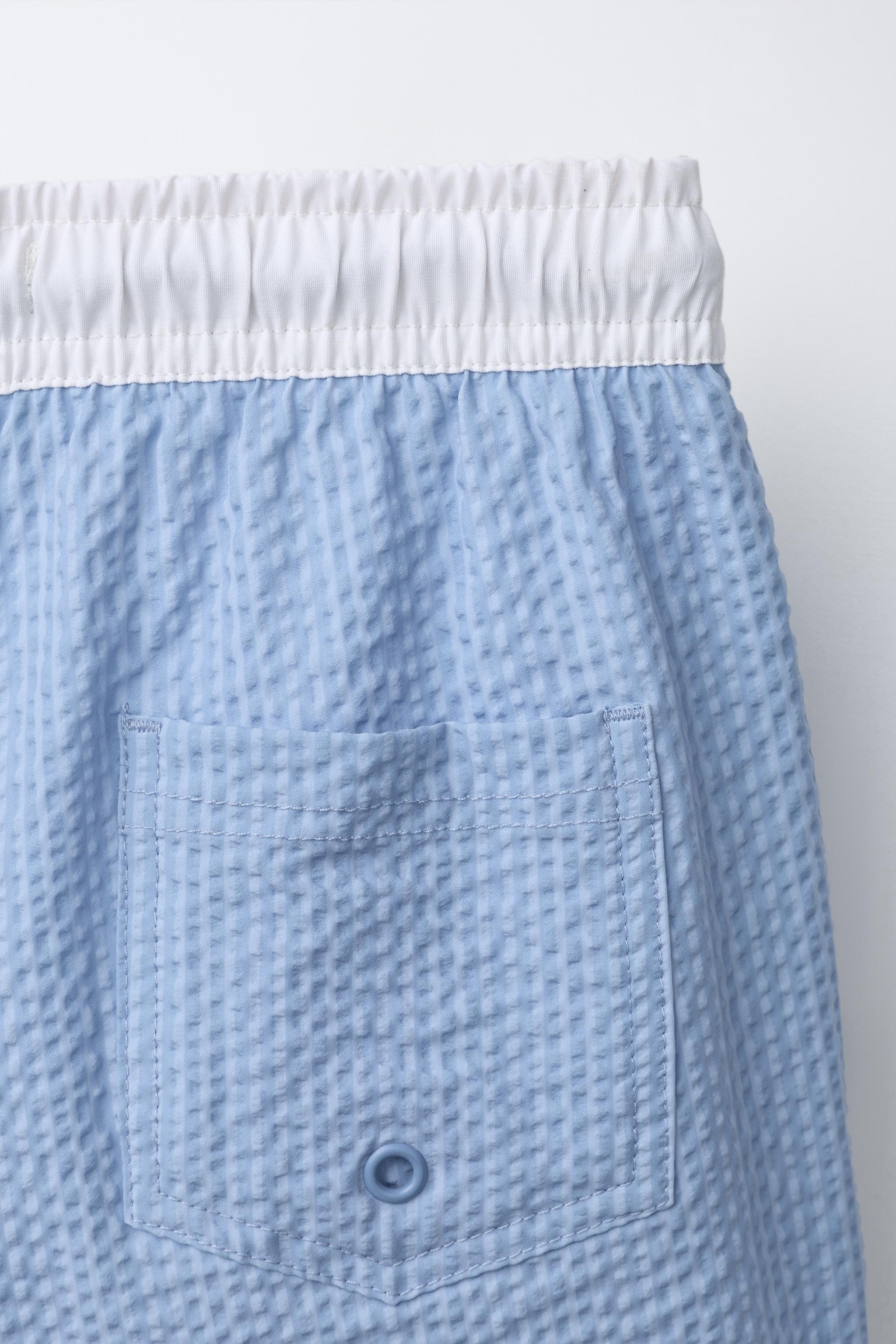 AGES 6-14 / LABEL SWIM SHORTS