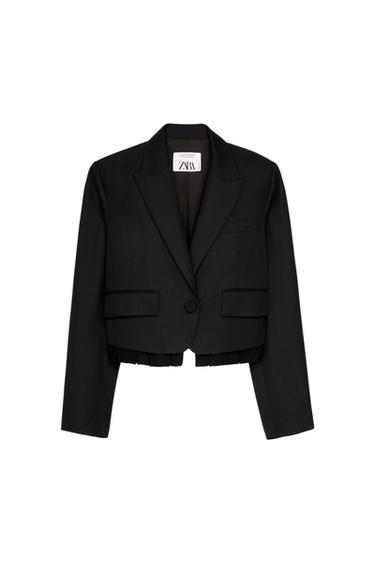 Front view of a short black jacket with lapels and front pockets.