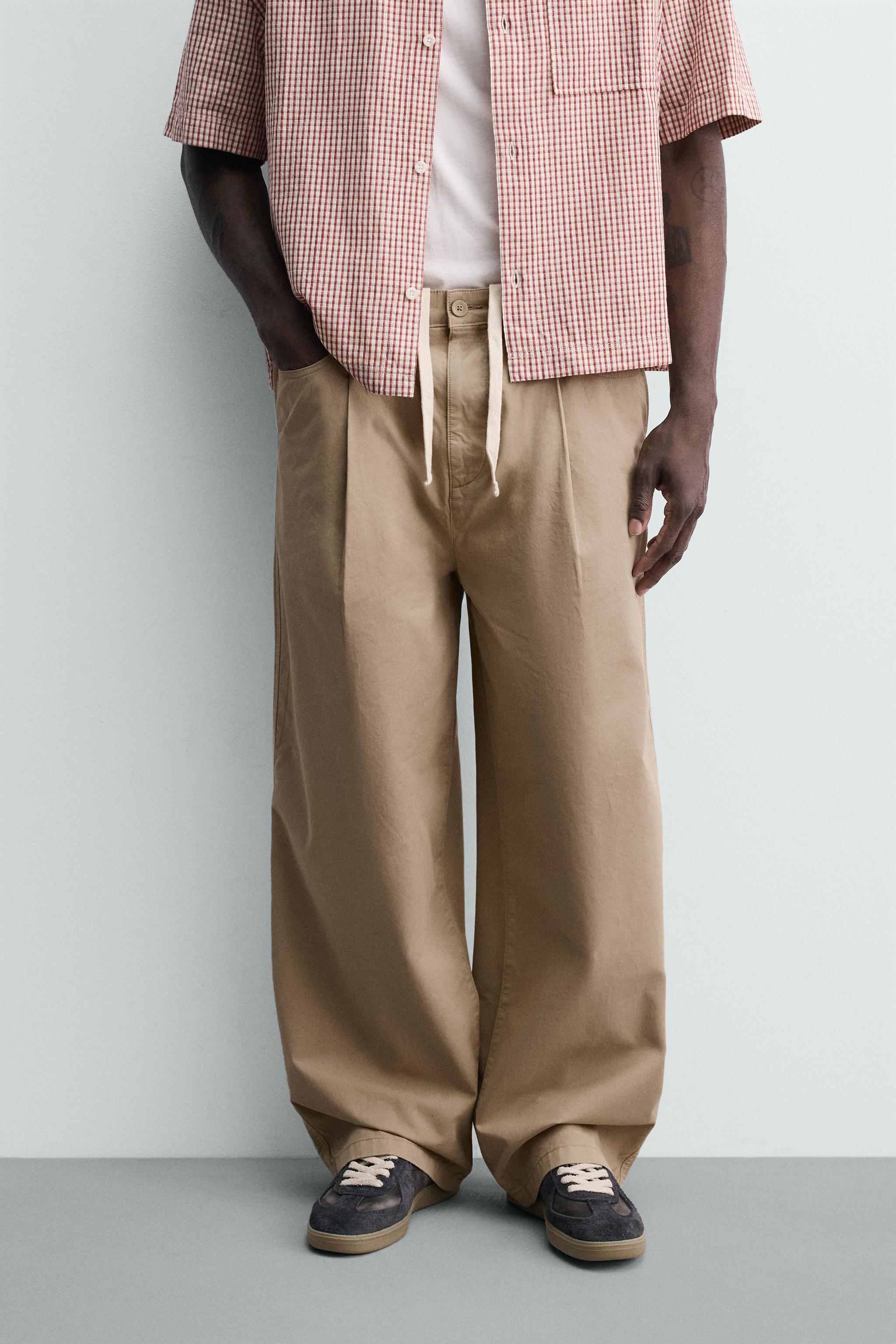 WIDE-LEG PLEATED CHINO TROUSERS — Beige
