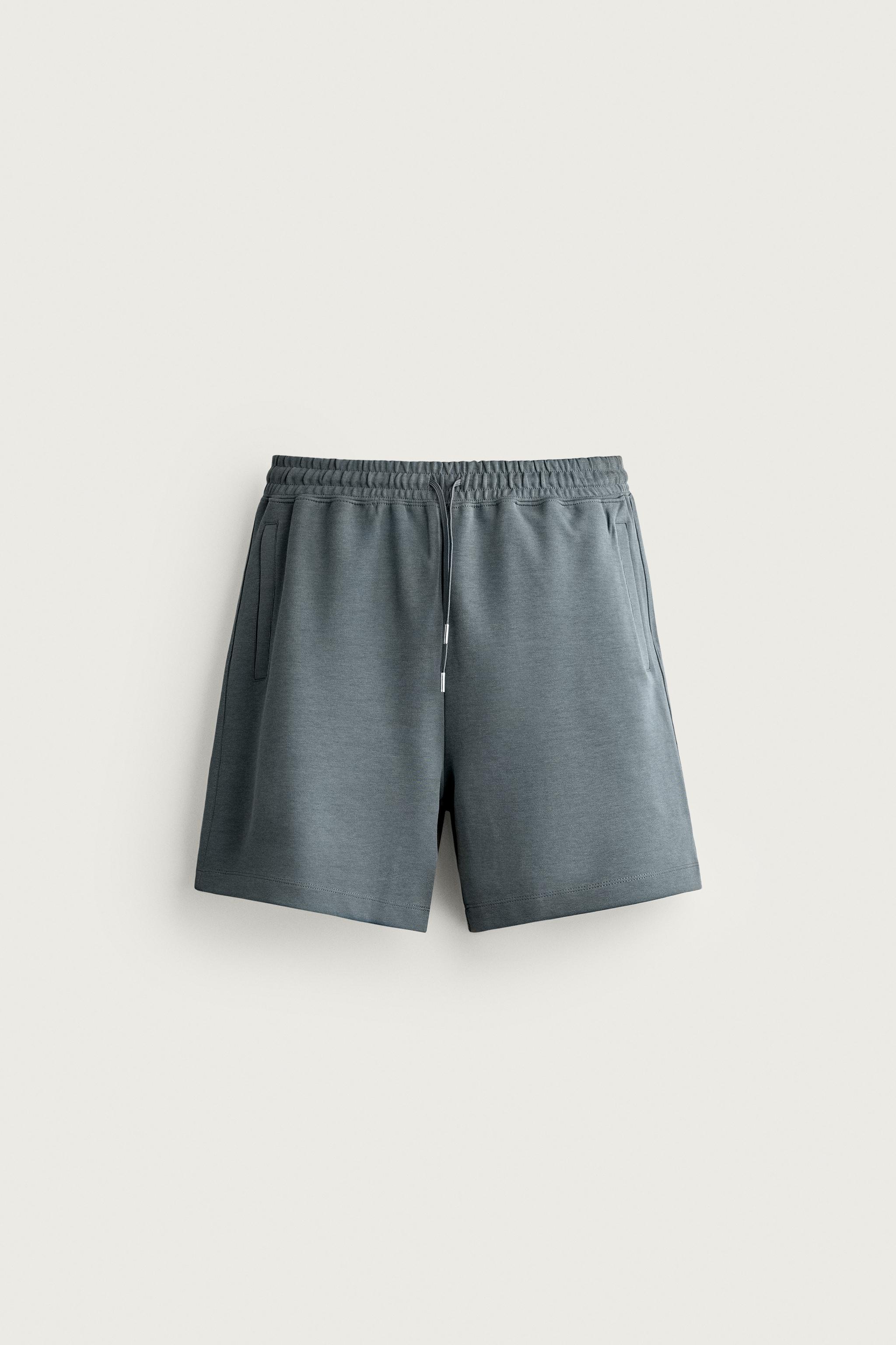 RELAXED FIT INTERLOCK TRACK SHORTS — Faded blue