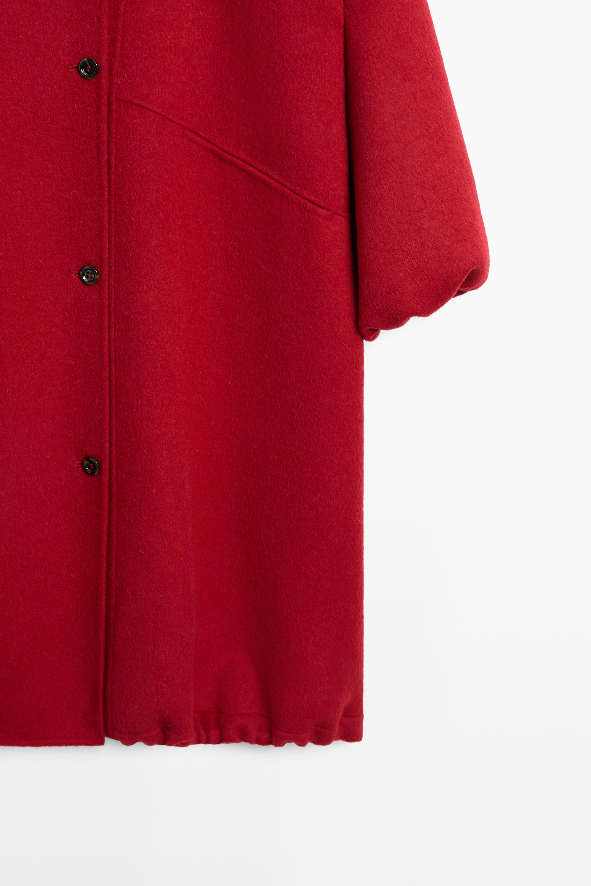 Long coat with asymmetrical collar detail