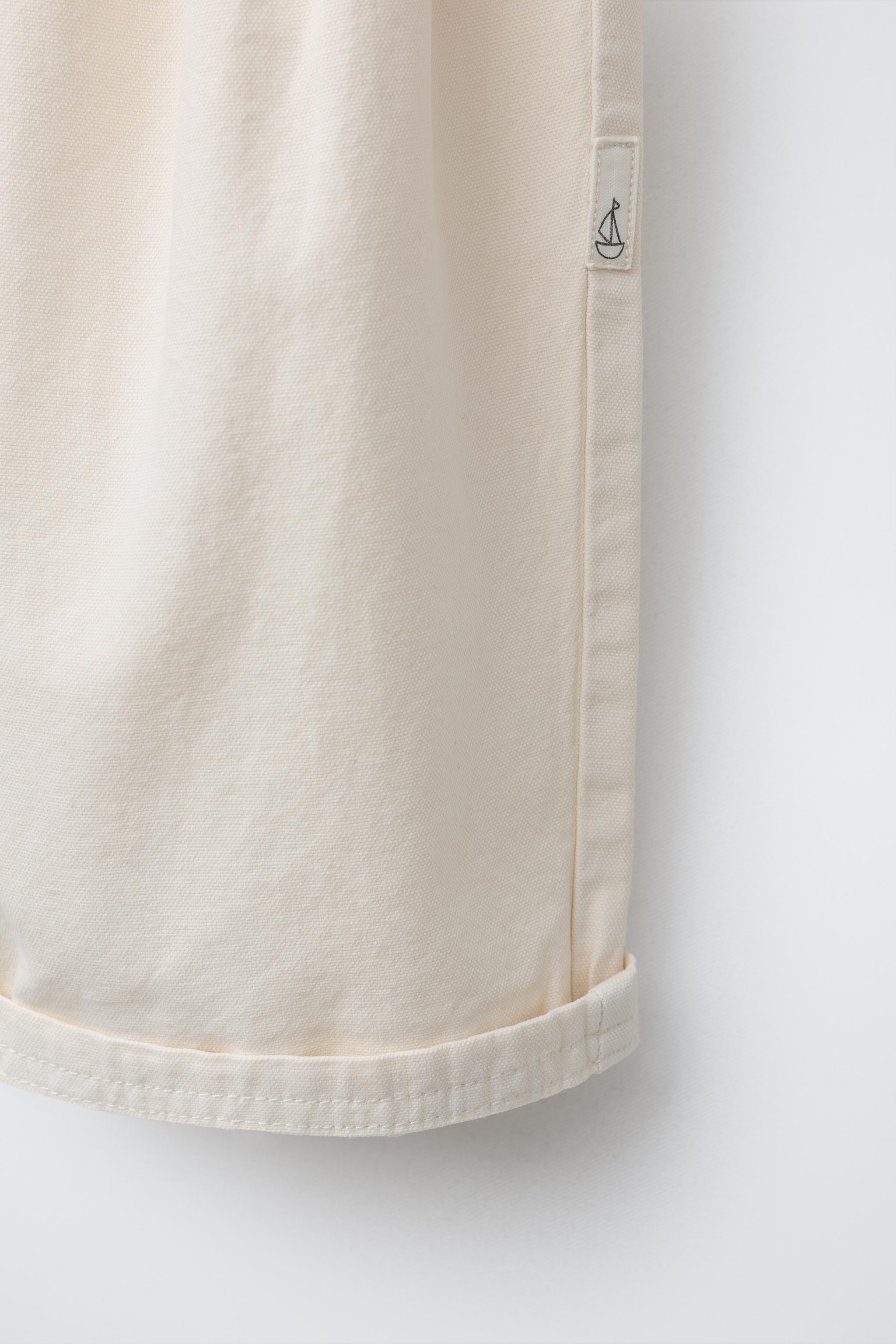 PANTALON BALLON EN TOILE AVEC ÉTIQUETTE