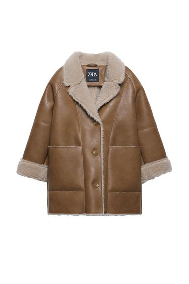 Front view of a brown coat with a shearling collar and cuffs, front pockets and large buttons.