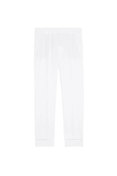 TROUSERS WITH ASYMMETRIC HEMS