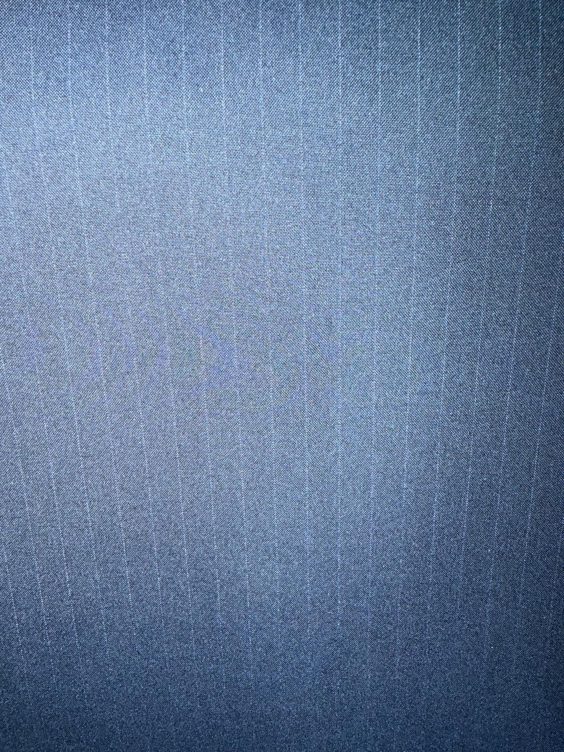 Gray fabric with a fine vertical line texture, creating a subtle pattern. The image shows a close-up of the material.