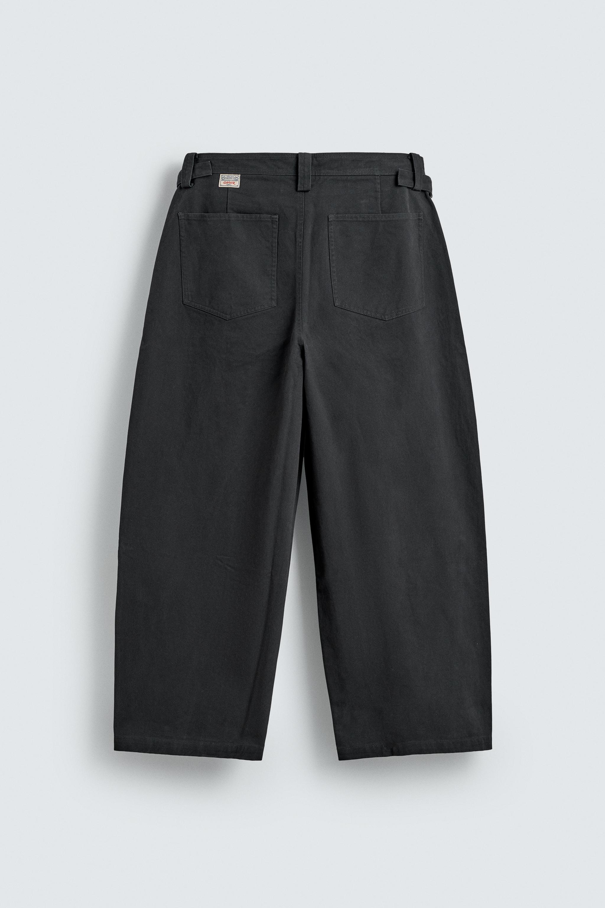 RELAXED FIT PANTS WITH TWISTED SEAM