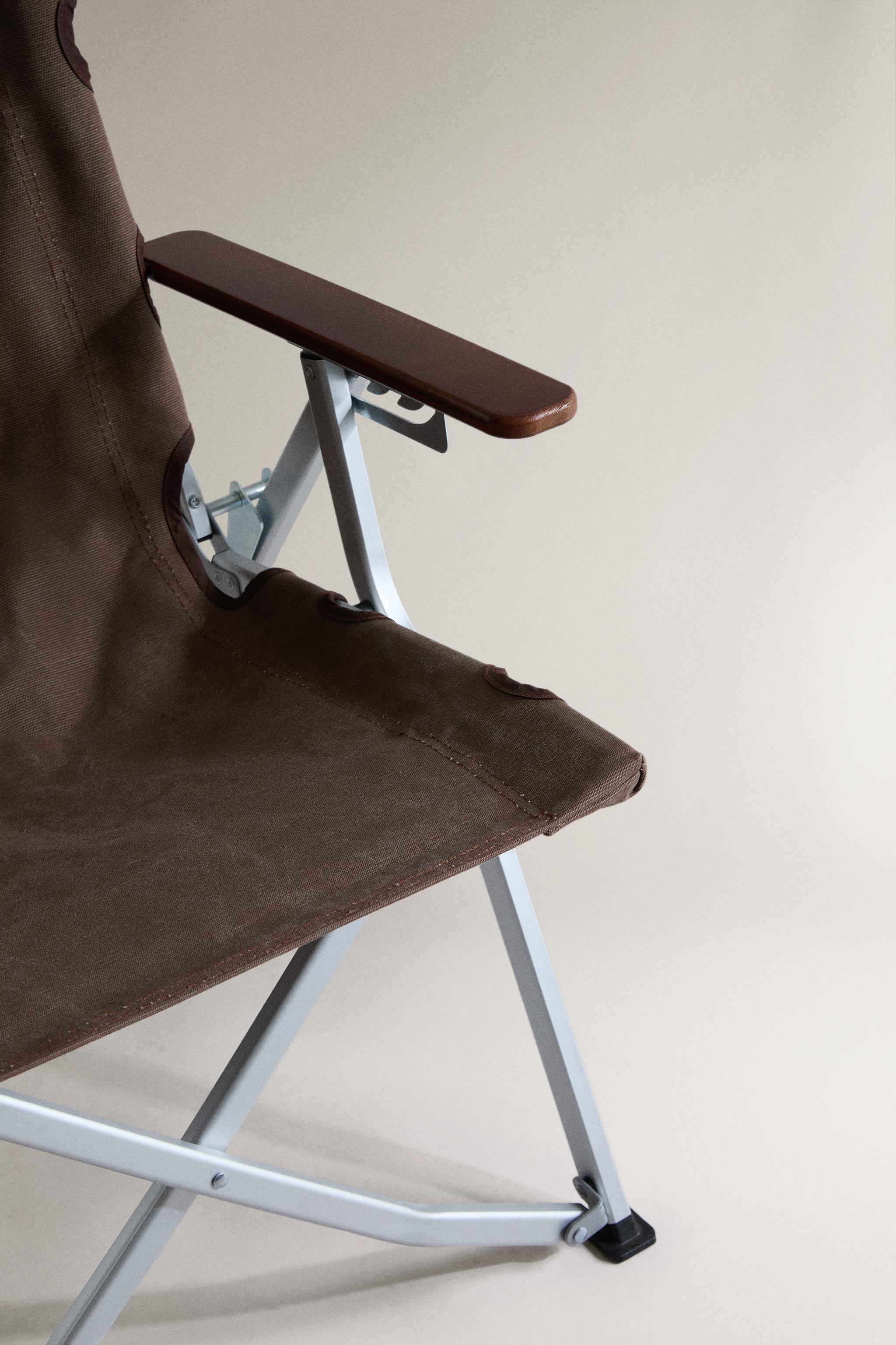CHAISE PLIANTE AVEC POIGNÉE ET ACCOUDOIRS