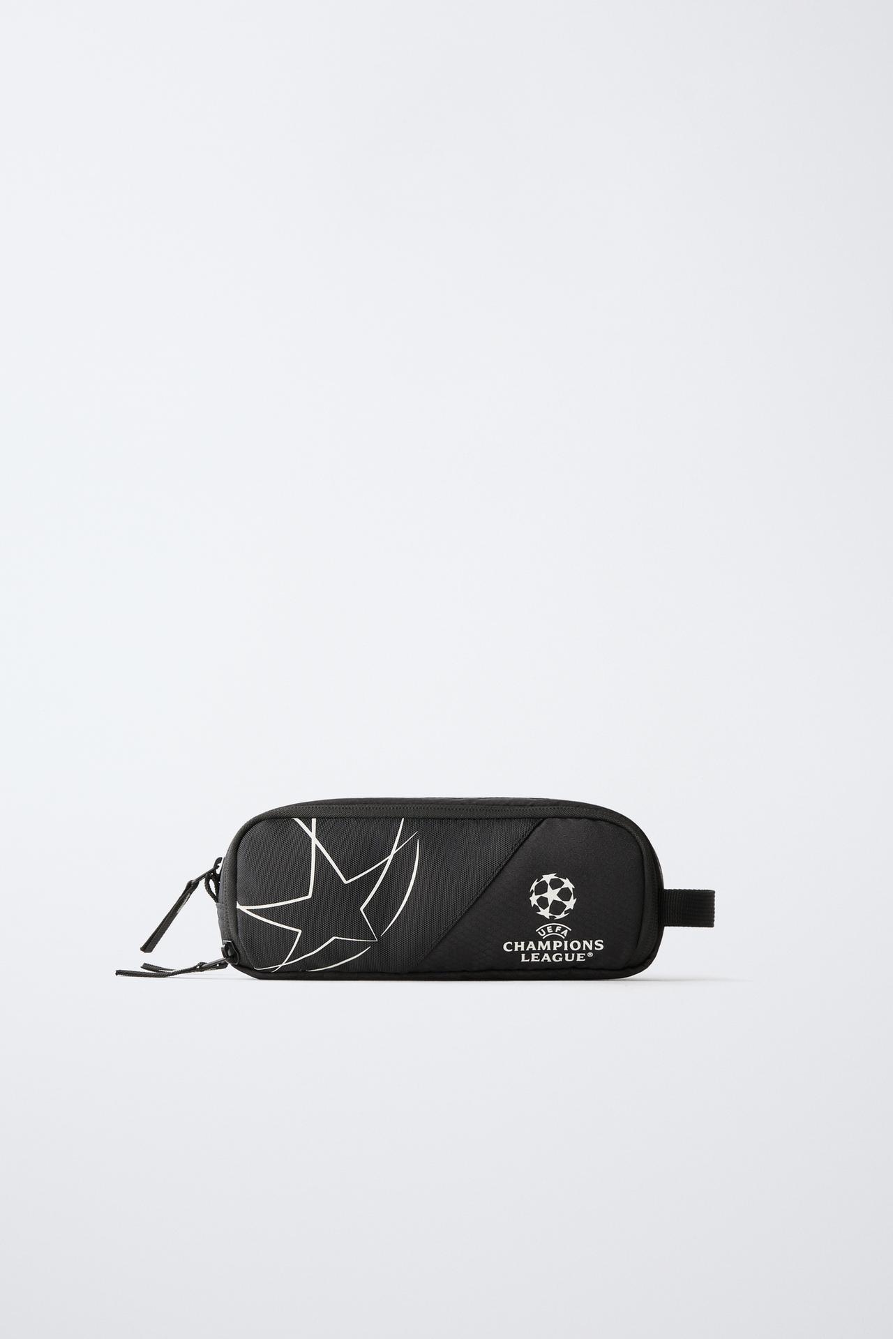 UEFA CHAMPIONS LEAGUE® GLOW-IN-THE-DARK POUCH — Black