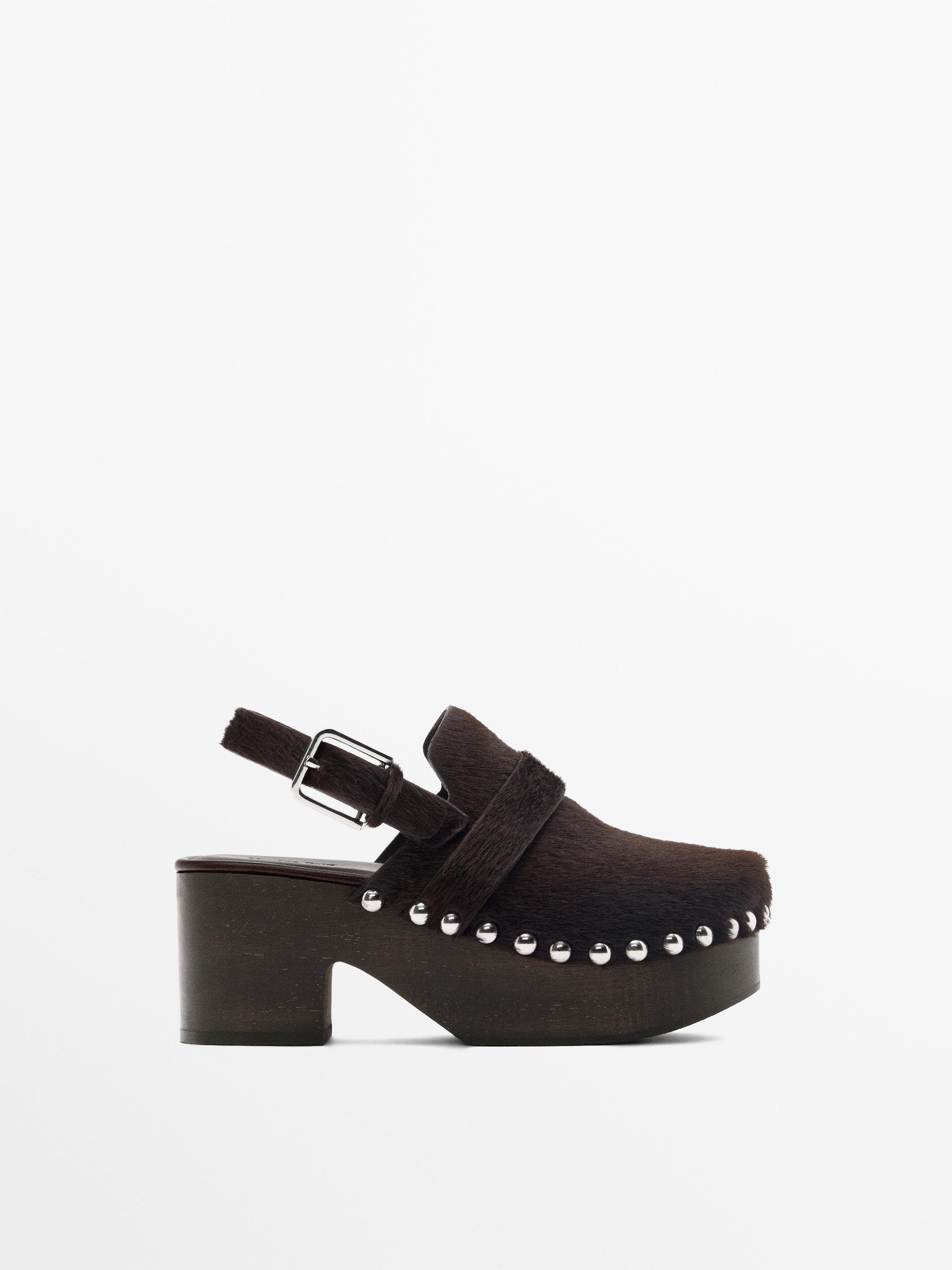 Hair on leather clogs with wooden sole