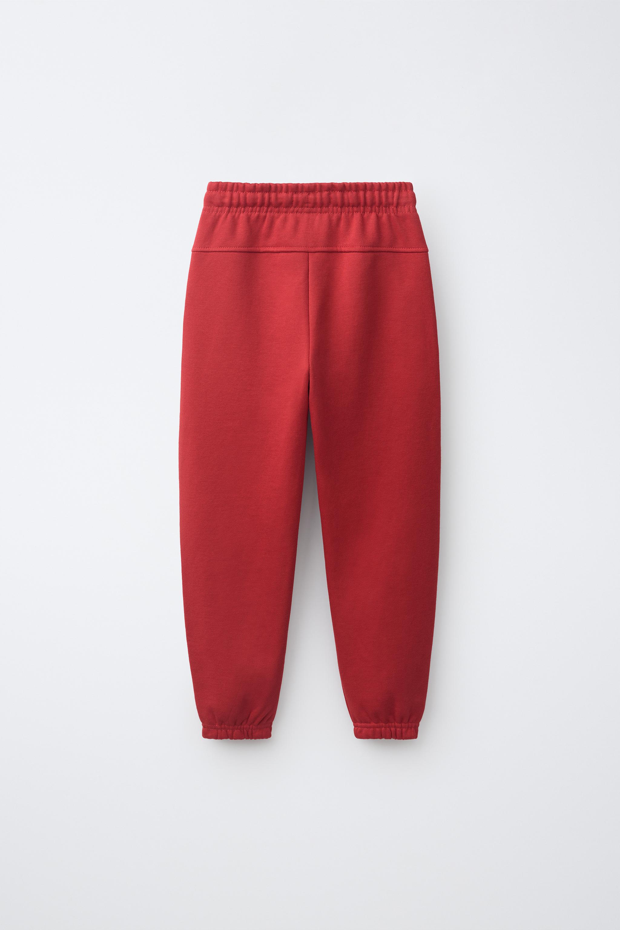 SOLID FLEECE JOGGERS WITH LABEL — Red