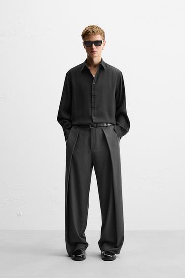 Zara Wide fit pants. Front pleats at waist. Side pockets and back welt pockets. Front zip and hidden metal hook closure. - Gray