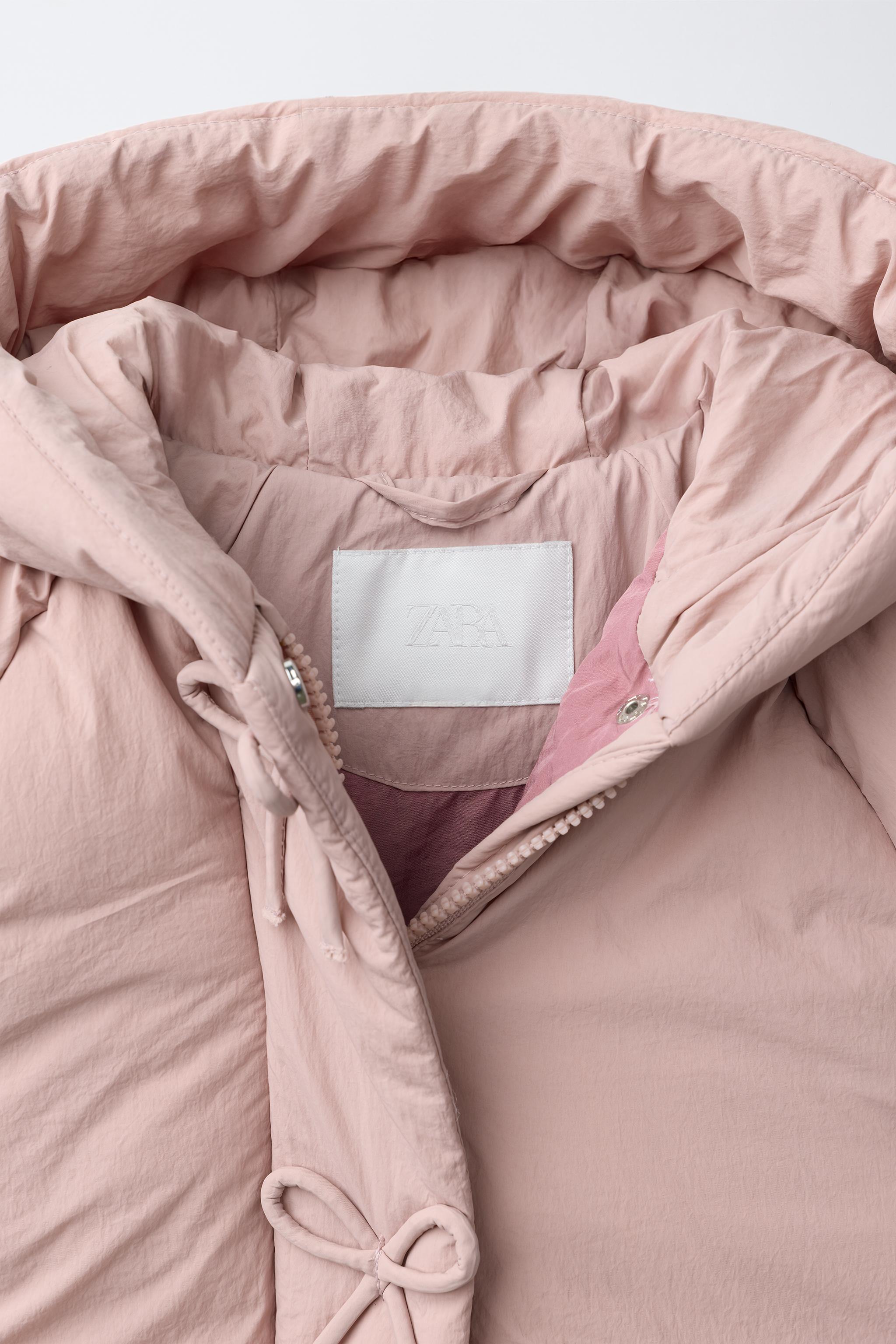 MANTEAU MATELASSÉ DÉPERLANT À NŒUDS