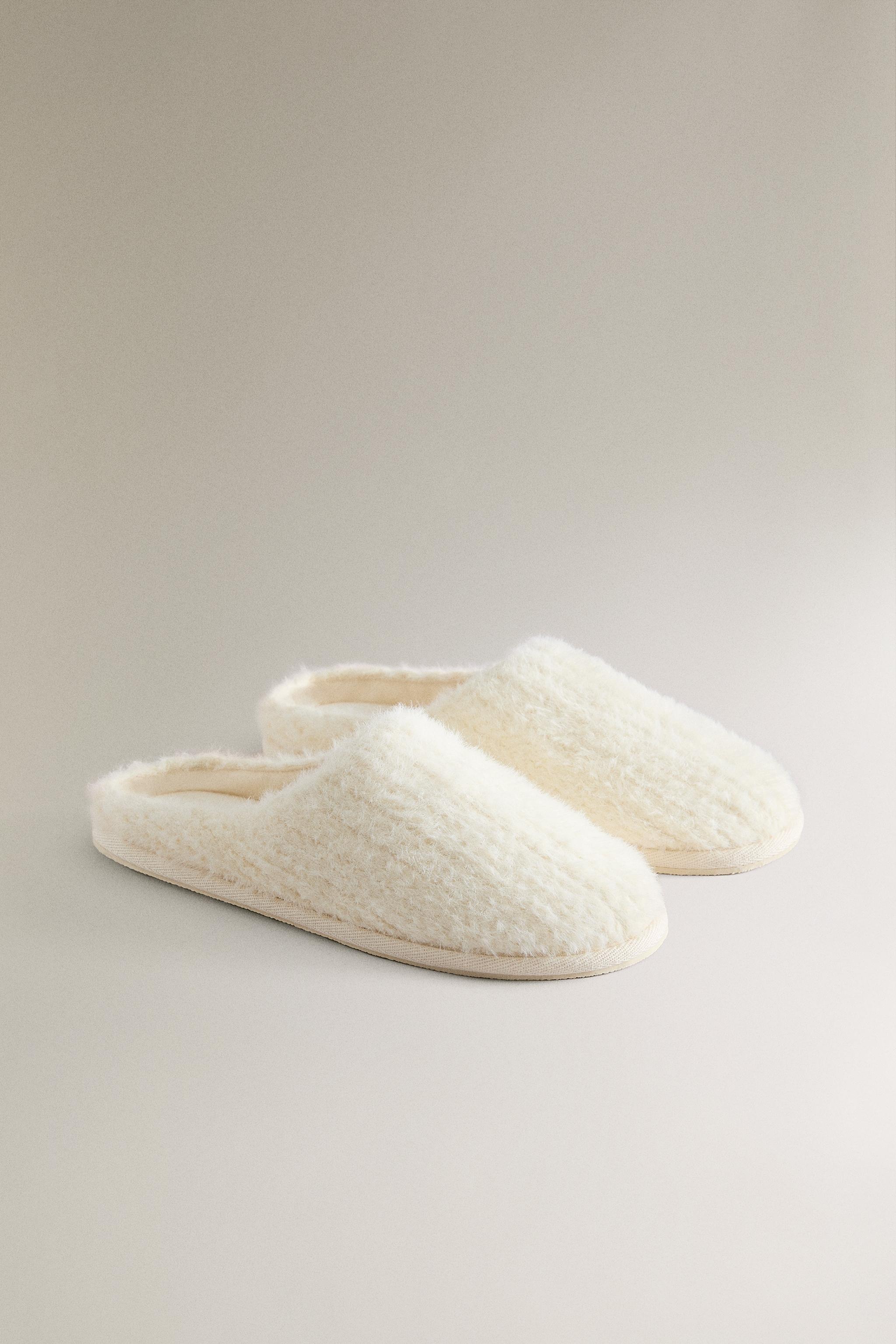 SLIPPERS WITH BRAIDED FAUX FUR DETAIL