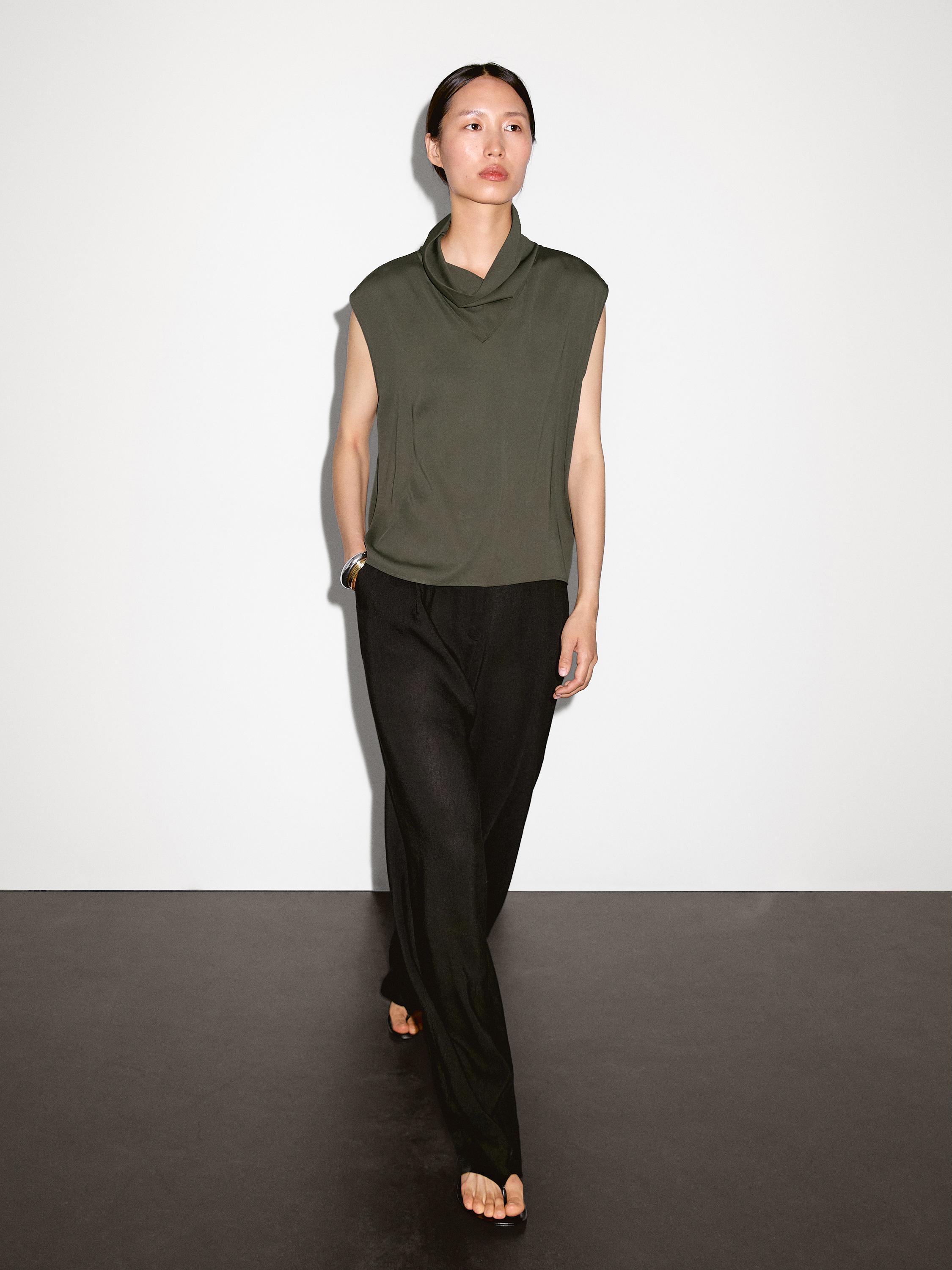 Flowing blouse with draped neck detail