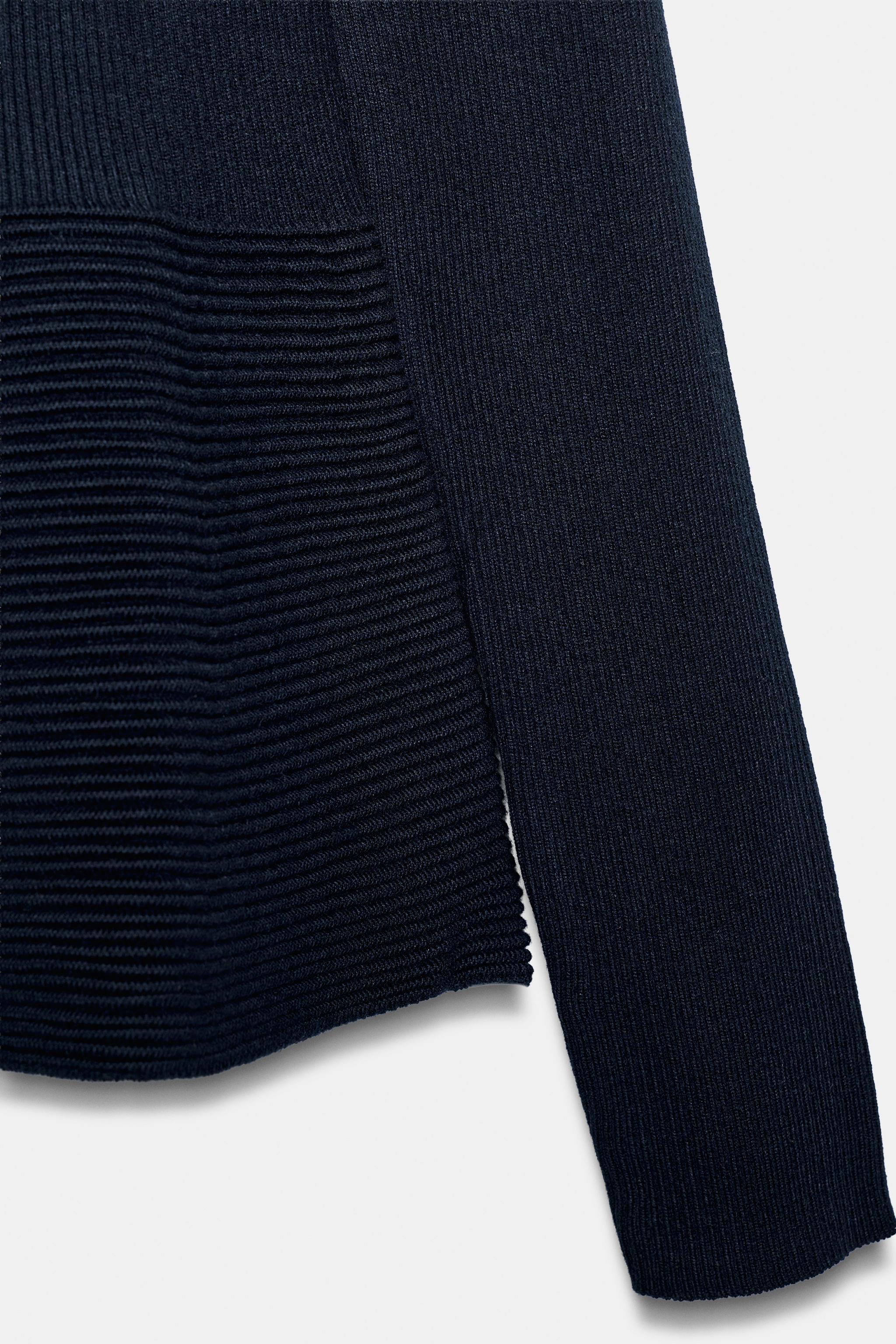 PEPLUM KNIT SWEATER