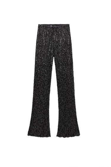 Front view of textured black straight-leg trousers.