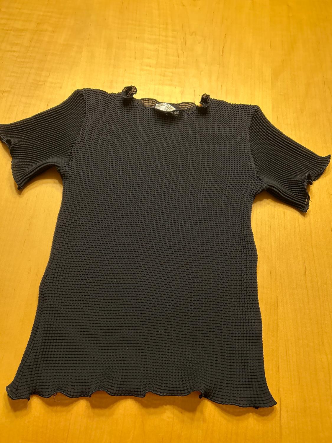 Front view of a black t-shirt with a ribbed texture and short sleeves.