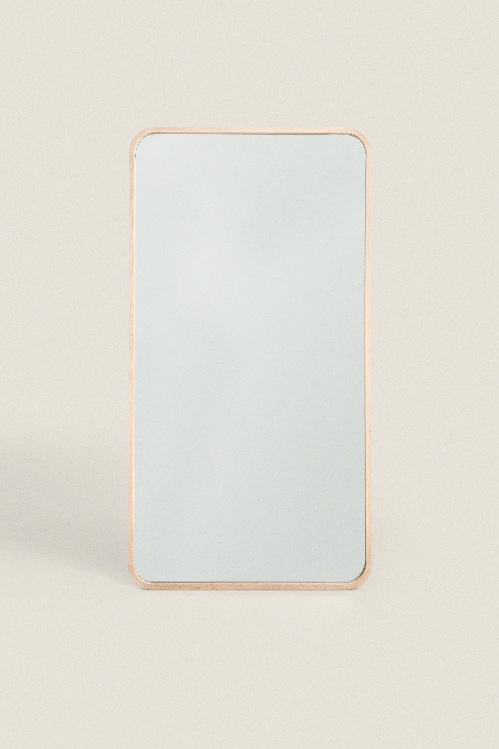Large hanging full length mirror with rounded frame light beige
