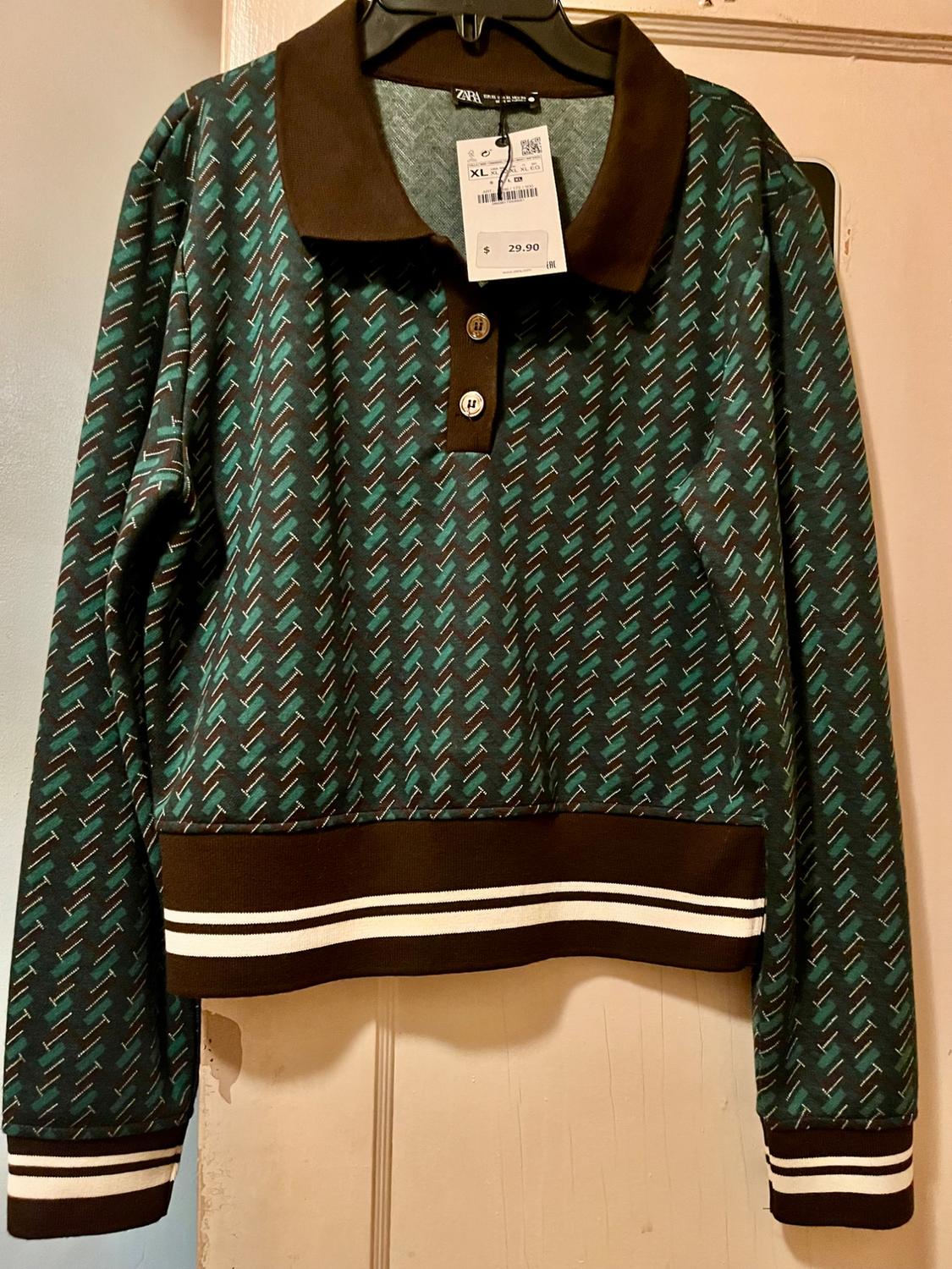 Polo with lapel collar and long sleeves. Rib trim. Front button closure. - Image 2