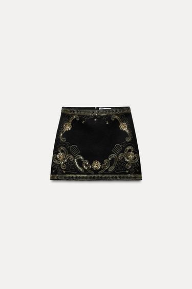FALDA MINI PUNTO ABALORIOS LENTEJUELAS - Negro oro de Zara