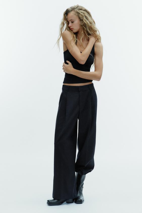PINSTRIPE PANTS WITH PLEATS AND FLAPS
