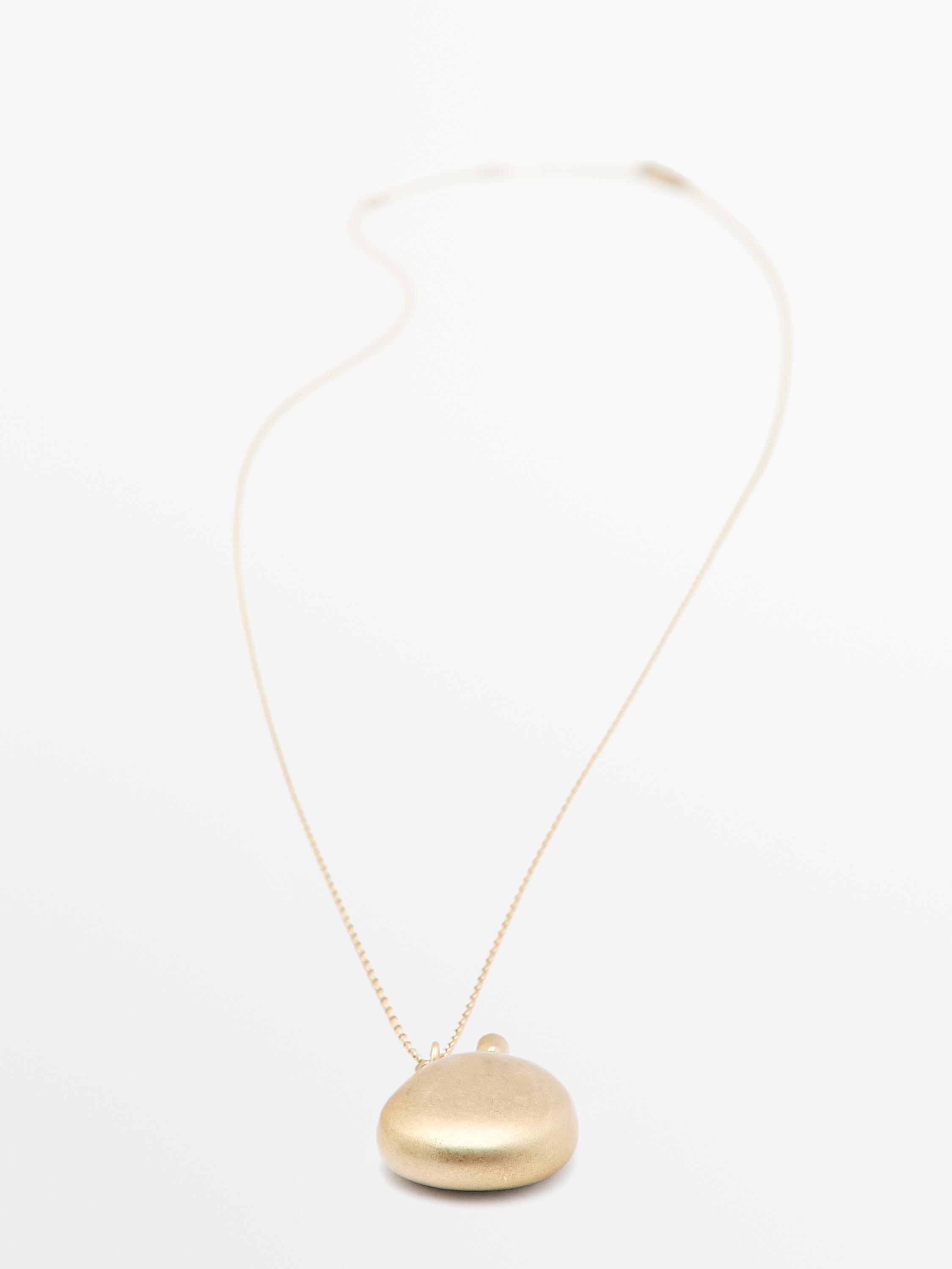 Necklace with metal pendant