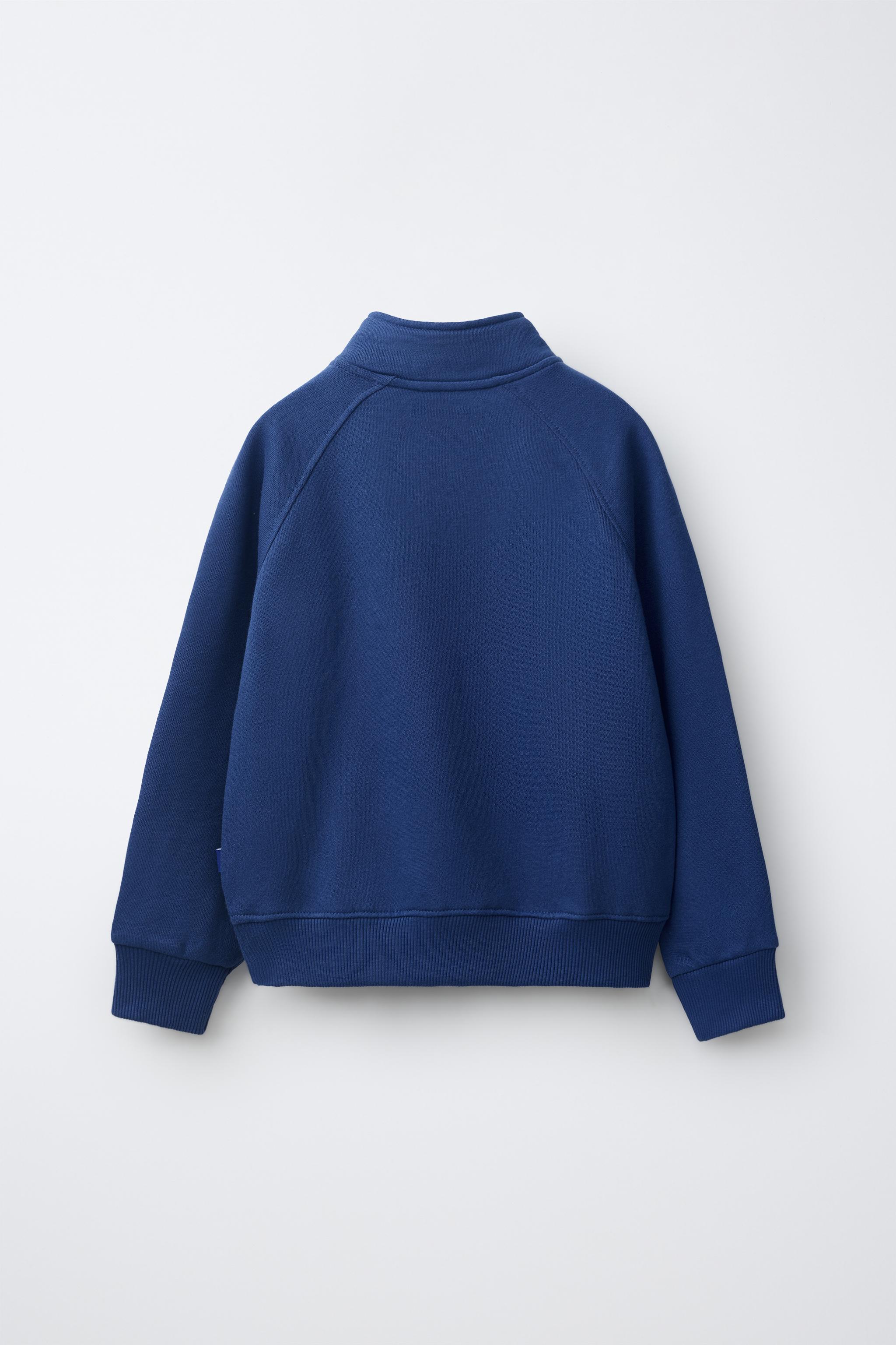 SWEAT UNI AVEC ÉTIQUETTE