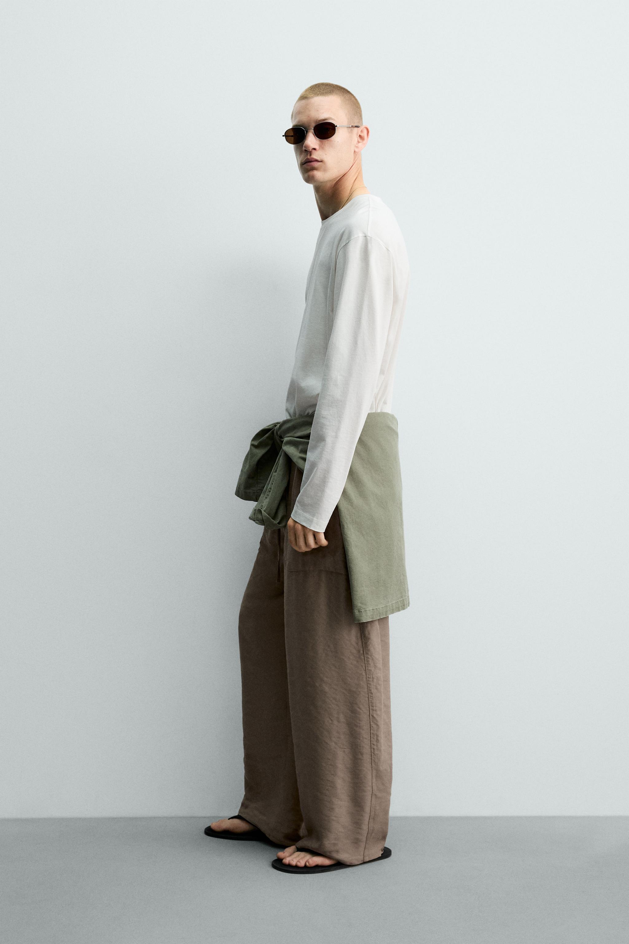 RELAXED FIT FLOWY PANTS — Beige-pink