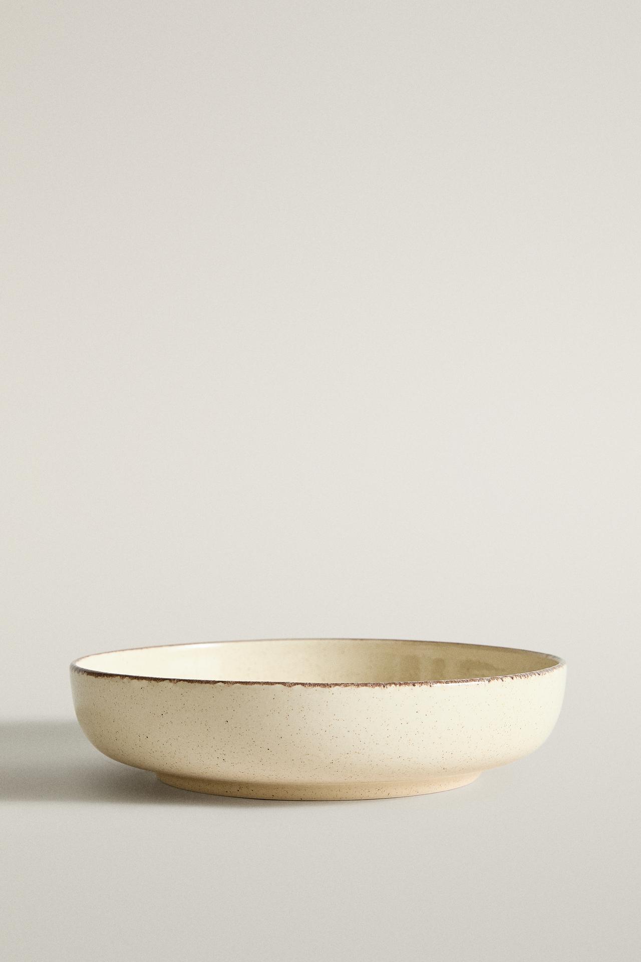 STONEWARE SOUP PLATE WITH AGED RIM — Light ecru