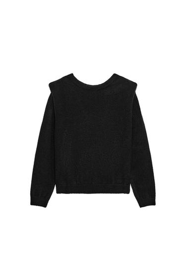 Rear view of black knitted jumper with shoulder pads, round neck and long sleeves.